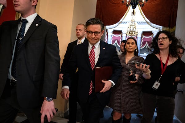 House Speaker Mike Johnson (R-La.) passes reporters as he walks to the House chamber on Capitol Hill in Washington, Friday, March 22, 2024. The Republ