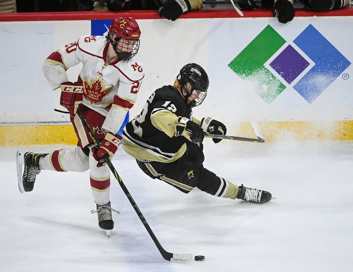 Maple Grove’s Danny Nelson skated past Andover’s Gavyn Thoreson during a high school game two years ago. Both players could be chosen in the NHL d
