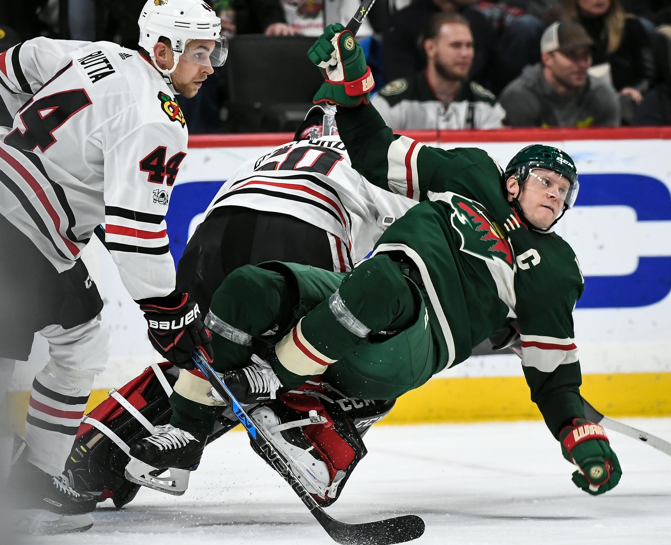 Minnesota Wild center Mikko Koivu (9) was called for goalkeeping interference after being tangled up with Chicago Blackhawks goalie Corey Crawford (50) in the second period. ] AARON LAVINSKY ï aaron.lavinsky@startribune.com The Minnesota Wild played the Chicago Blackhawks on Saturday, Nov. 4, 2017 at Xcel Energy Center in St. Paul, Minn.