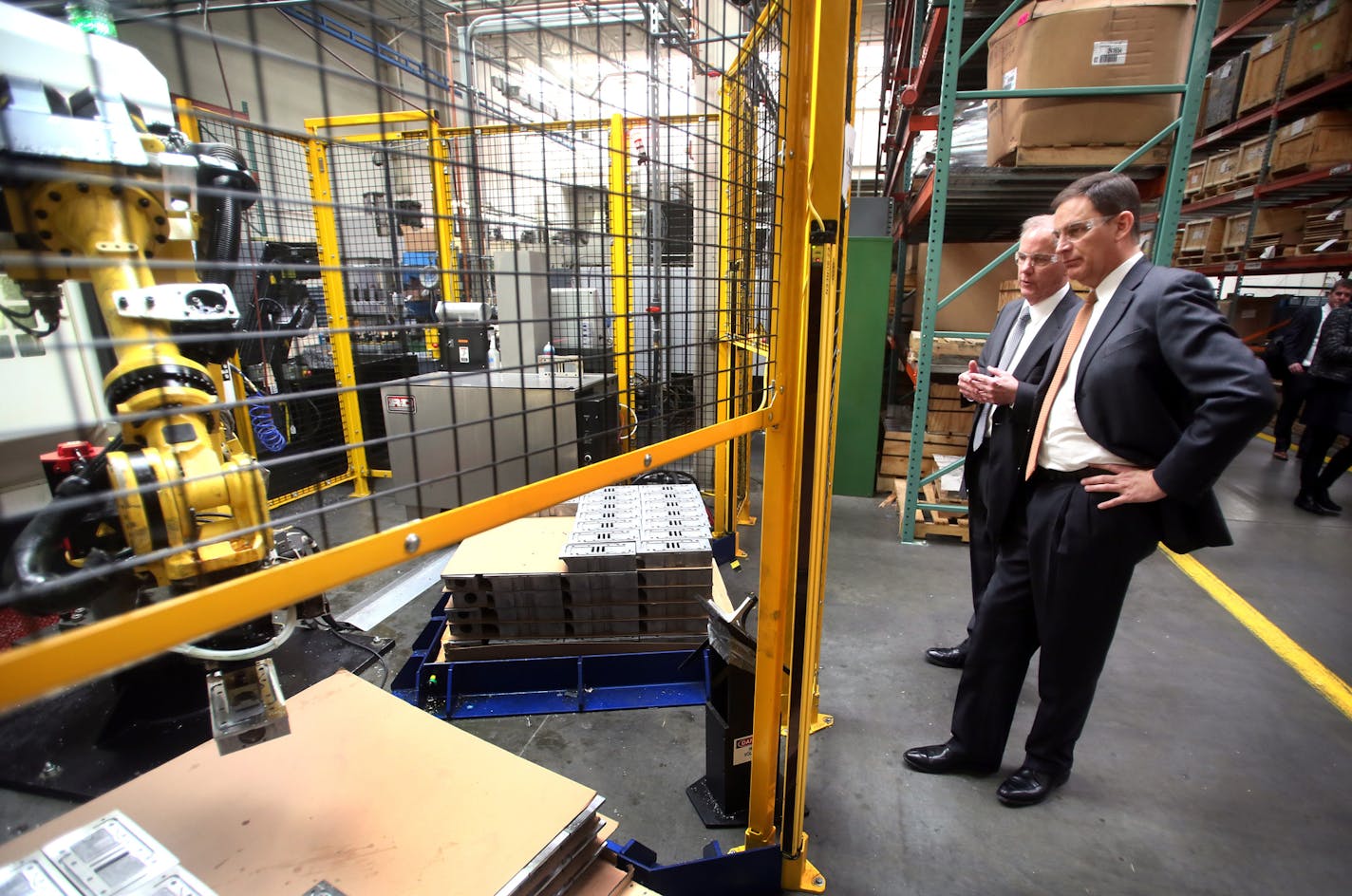 National Association of Manufacturers President Jay Timmons, front, toured the Graco factory in Minneapolis, accompanied by Chuck Rescorla, vice president of corporate manufacturing at Graco Wednesday, Feb. 4, 2015, in Minneapolis, MN.](DAVID JOLES/STARTRIBUNE)djoles@startribune.com National Association of Manufacturers President Jay Timmons spoke about the state of manufacturing in America before the Economic Club of Minnesota at the Minneapolis Convention Center. Timmons later toured Graco's M