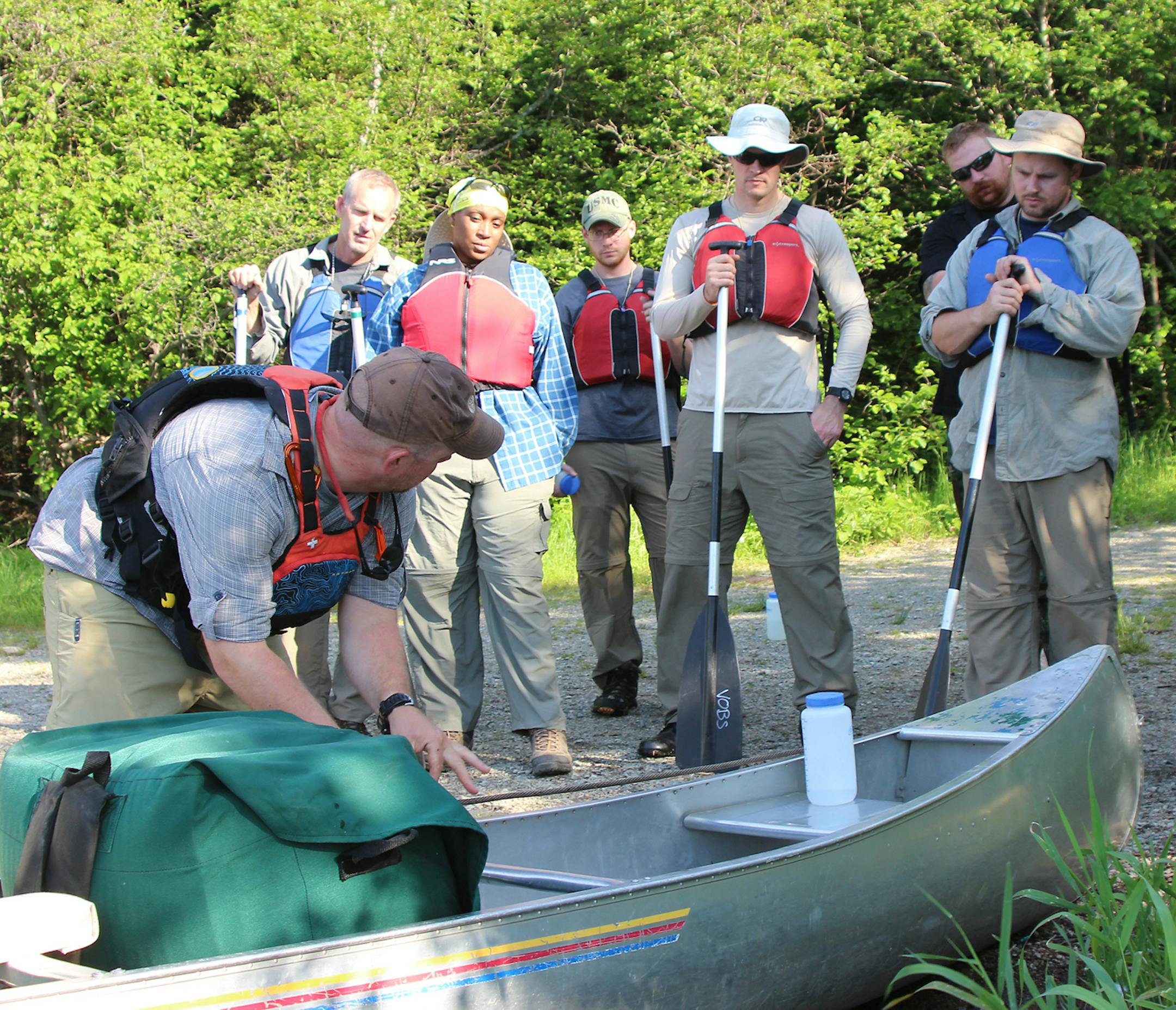 VOBS instructor Kevin Morris gives a pre-course knot-tying refresher to the veterans on the expedition.