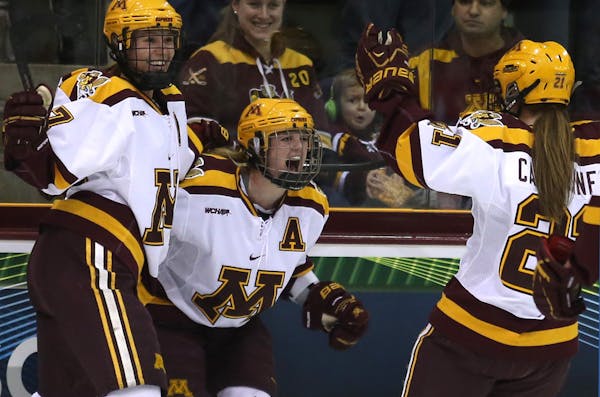 Gopher Kelly Terry celebrated with teammates after scoring her third goal , a hat trick during the third period. ] (KYNDELL HARKNESS/STAR TRIBUNE) kyn
