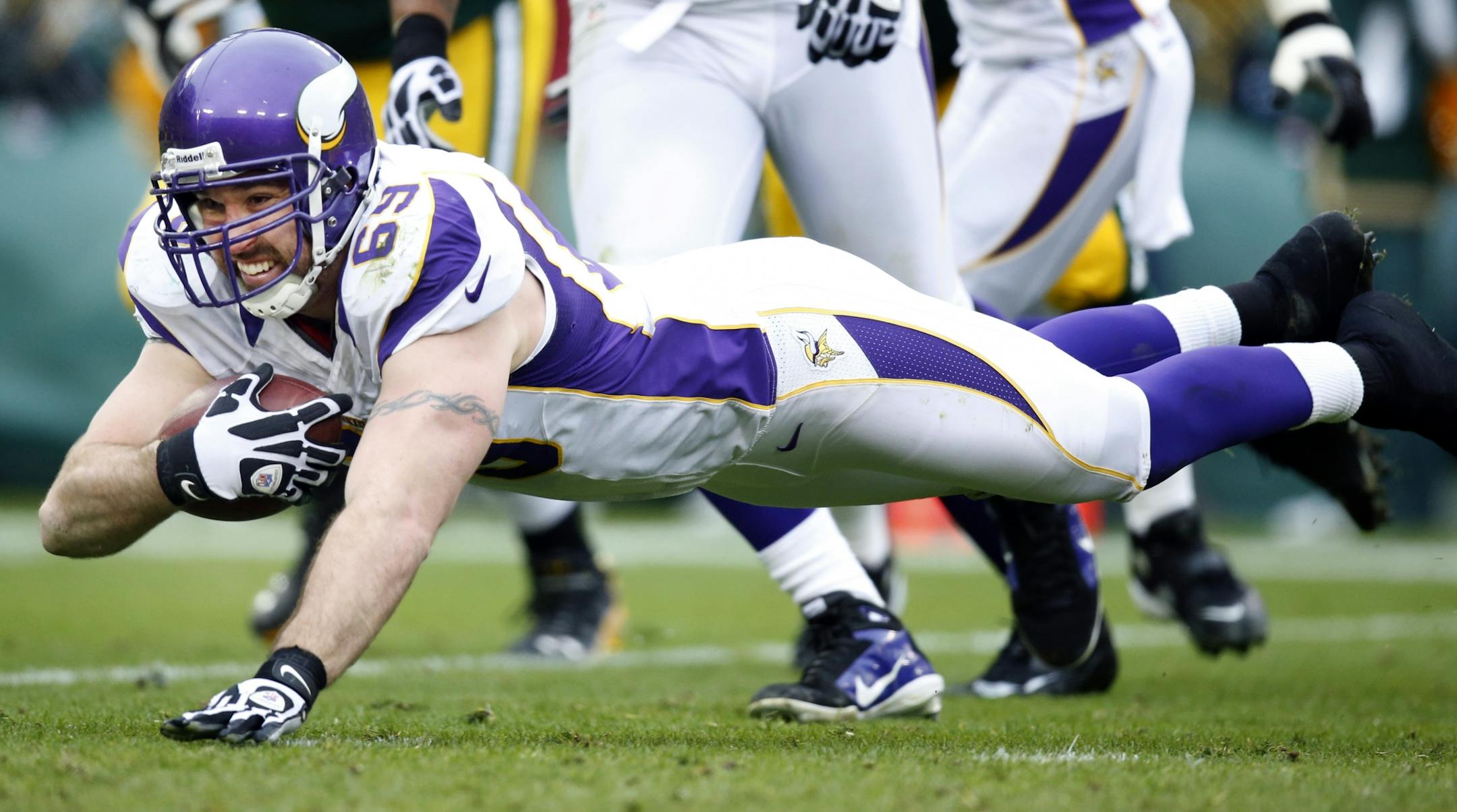 Jared Allen intercepted an Aaron Rodgers pass in the first game against Green Bay this season, but the play was negated by penalties.