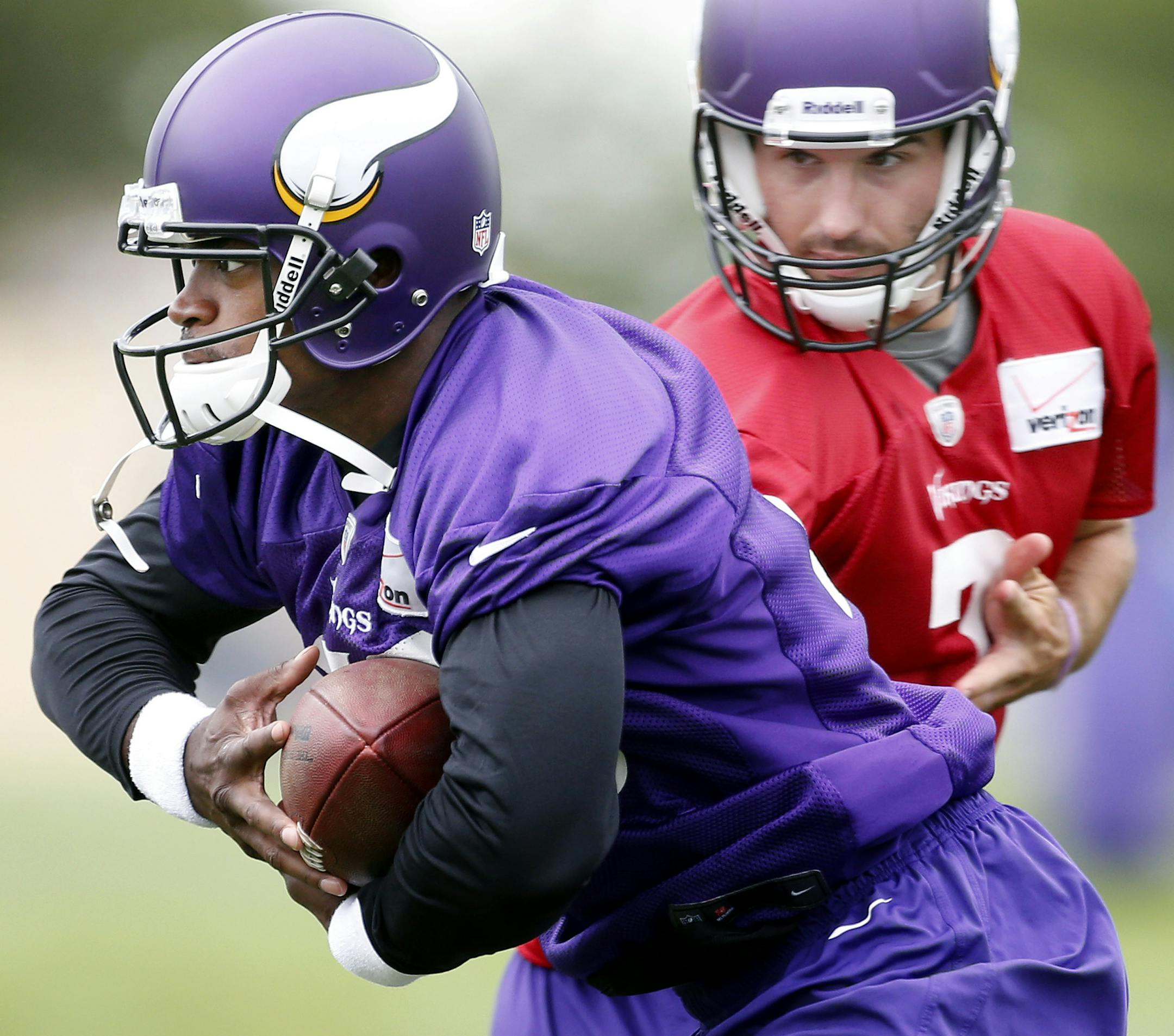 Minnesota Vikings Adrian Peterson (28) and Christian Ponder (7). ] CARLOS GONZALEZ cgonzalez@startribune.com July 27, 2013, Minnesota Vikings Training Camp, Mankato, Minn., Minnesota State University, Mankato -