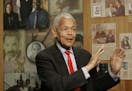 FILE- In this Oct. 13, 2006, file photo, Julian Bond, chairman of the Board for The National Association for the Advancement of Colored People, gestur