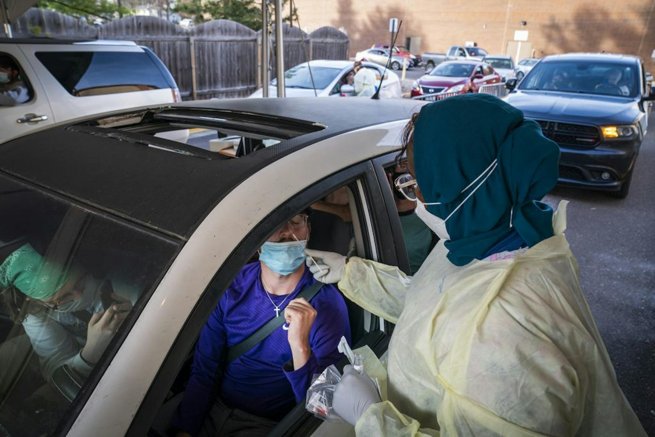 Britton Peterson, 21, a student at North Central University in Minneapolis, got tested with his friends who had all been exposed to someone COVID-19 positive, at the drive-through COVID-19 testing site at North Memorial Health in Robbinsdale..