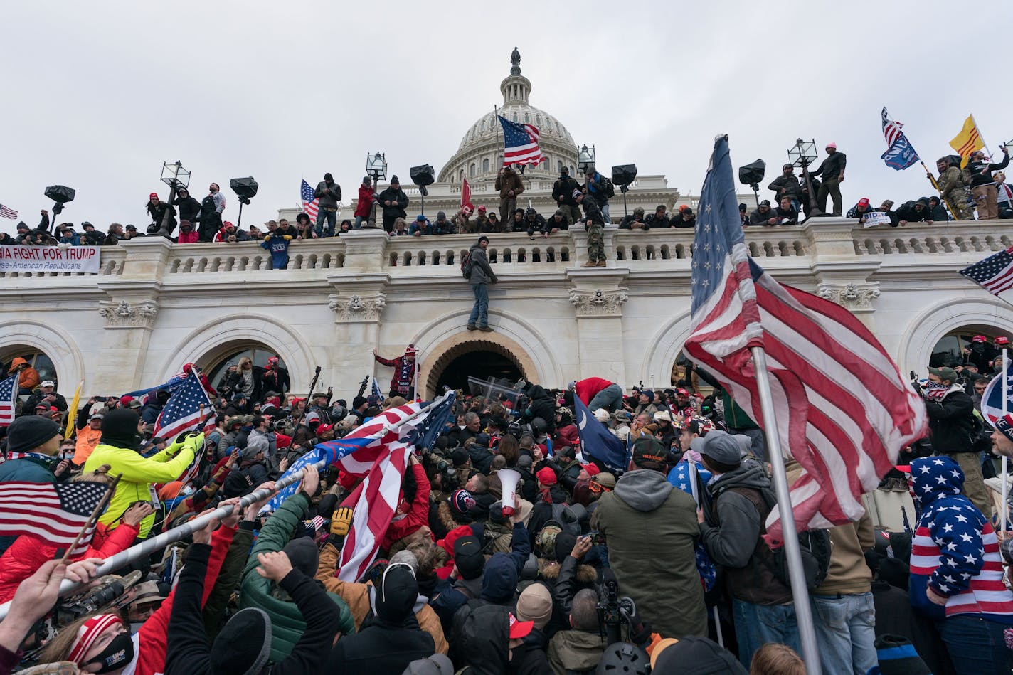 Pro-Trump supporters push back against police at the United States Capitol Building in Washington, D.C., on Jan. 6. Six Capitol Police have been suspended in connection with their role in the riots. (Jessica Griffin/The Philadelphia Inquirer/TNS