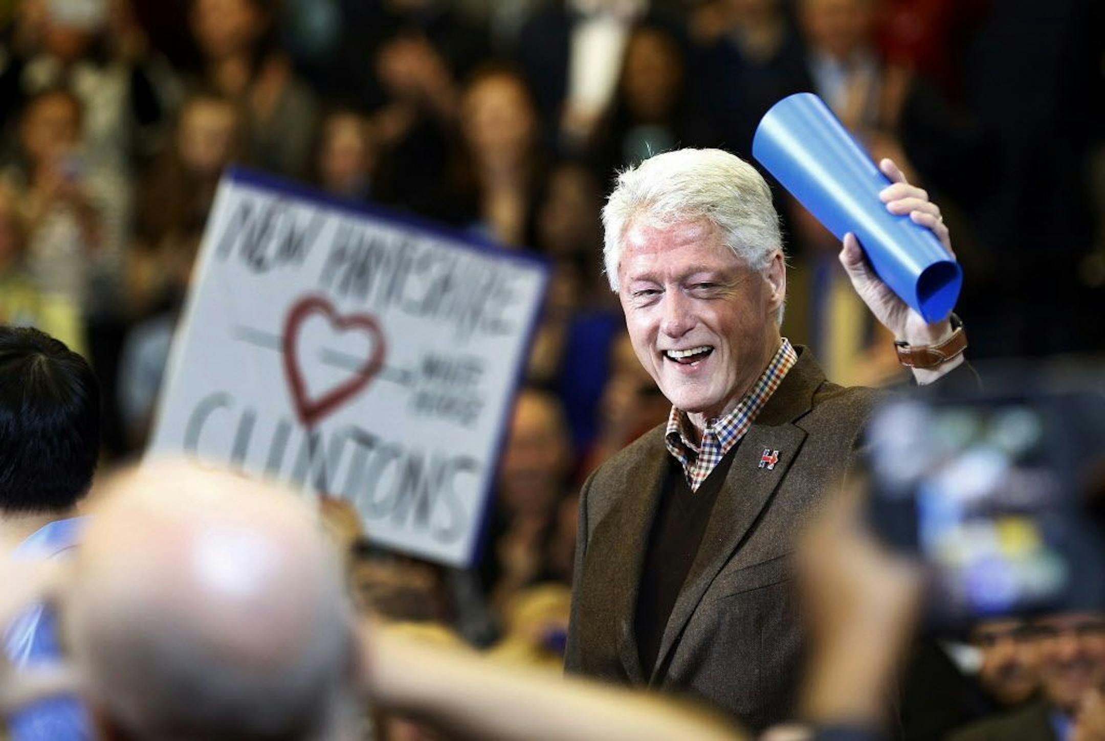 Former President Bill Clinton waves to a cheering crowd as he arrives during a campaign stop for his wife, Democratic presidential candidate Hillary Clinton, Monday, Jan. 4, 2016, in Nashua, N.H.