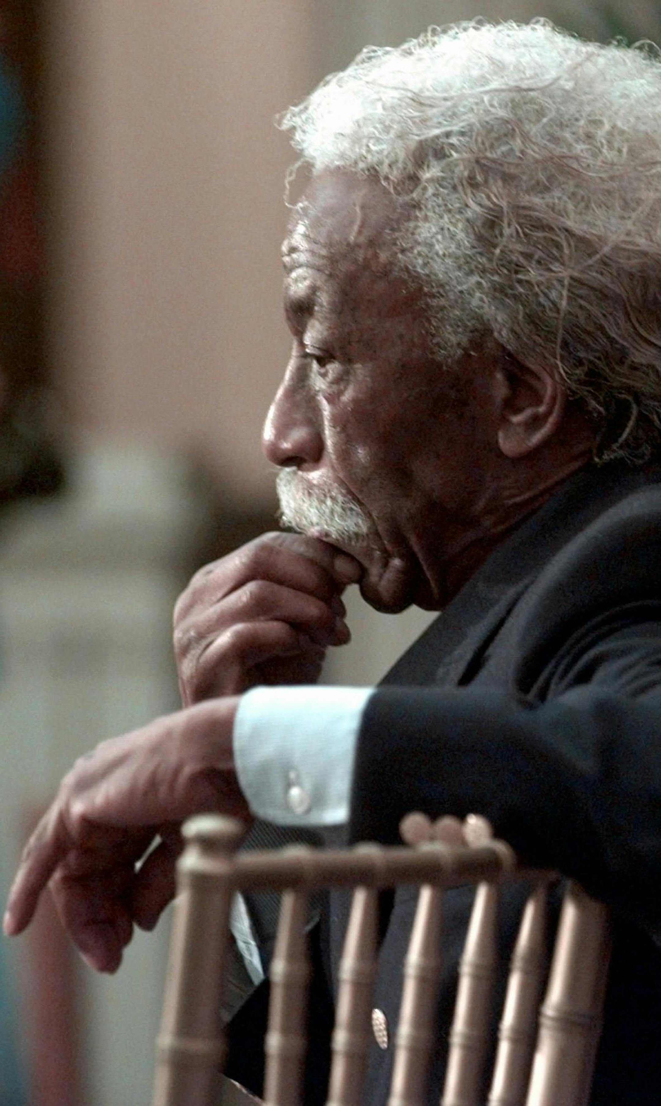 ** FILE** Photographer Gordon Parks pauses during the opening of an exhibit of his works "Half Past Autumn," in this Tuesday Sept. 9, 1997 file photo at the Corcoran Gallery in Washington. Parks, who captured the struggles and triumphs of black America as a photographer for Life magazine and then became Hollywood's first major black director with "The Learning Tree" and the hit "Shaft," died Tuesday, March 7, 2006 a family member said. He was 93. (AP Photo/Susan Walsh)