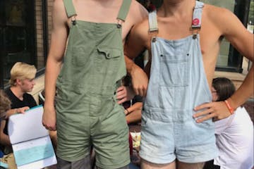 Two male students at Edina High School wore overalls without shirts underneath to protest the rumored changes to the school dress code.