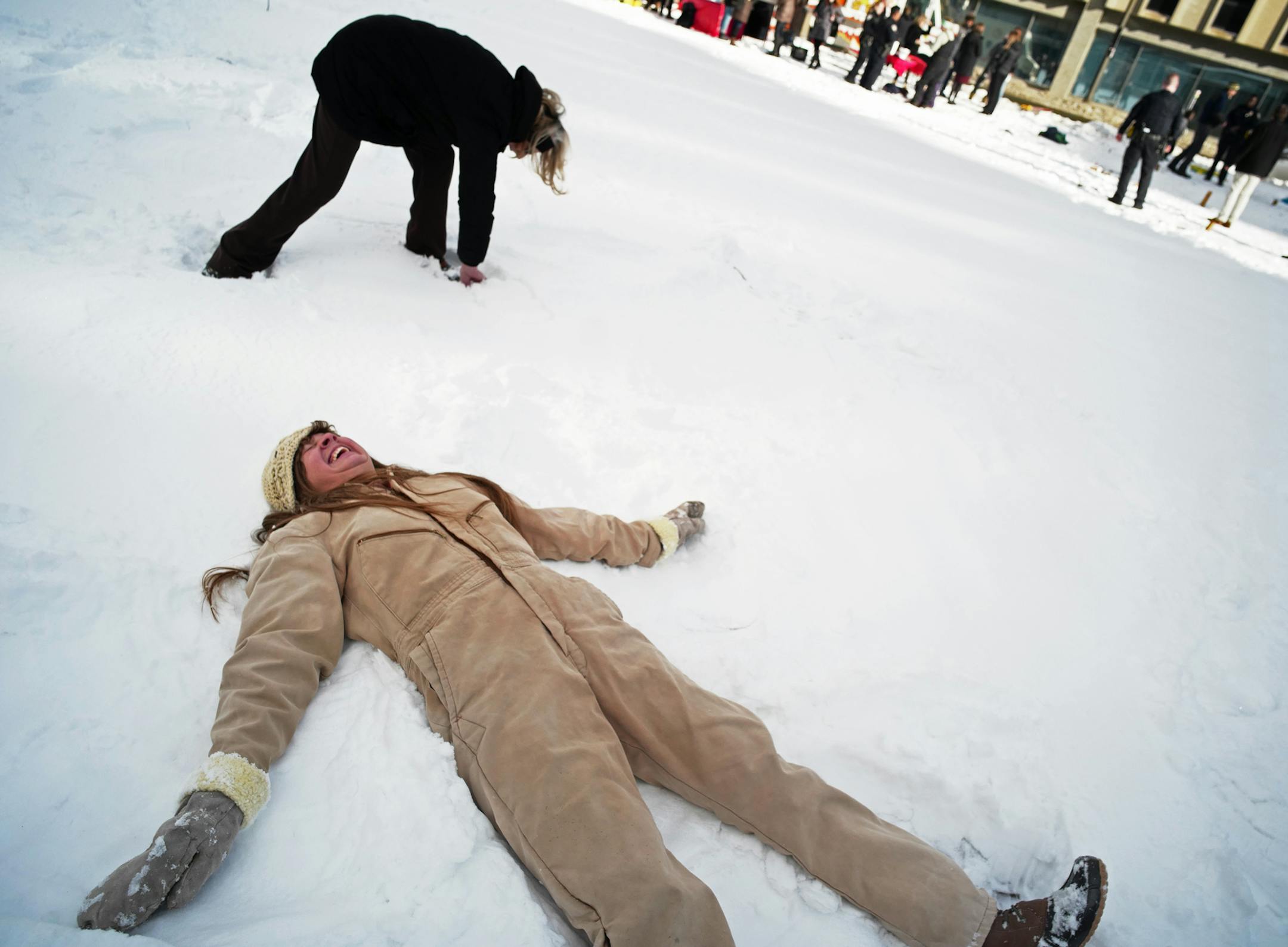 Amy Kanada, who works nearby, enjoyed making a snow angel. She would like to see a community garden come into the empty lot.]Over the next several months, the area near the Green Line's Central Station in St. Paul will host a series of pop-up events designed to make this vacant space at the center of downtown more inviting and vibrant for transit riders, employees, residents and visitors. Richard Tsong-Taatarii/rtsong-taatarii@startribune.com
