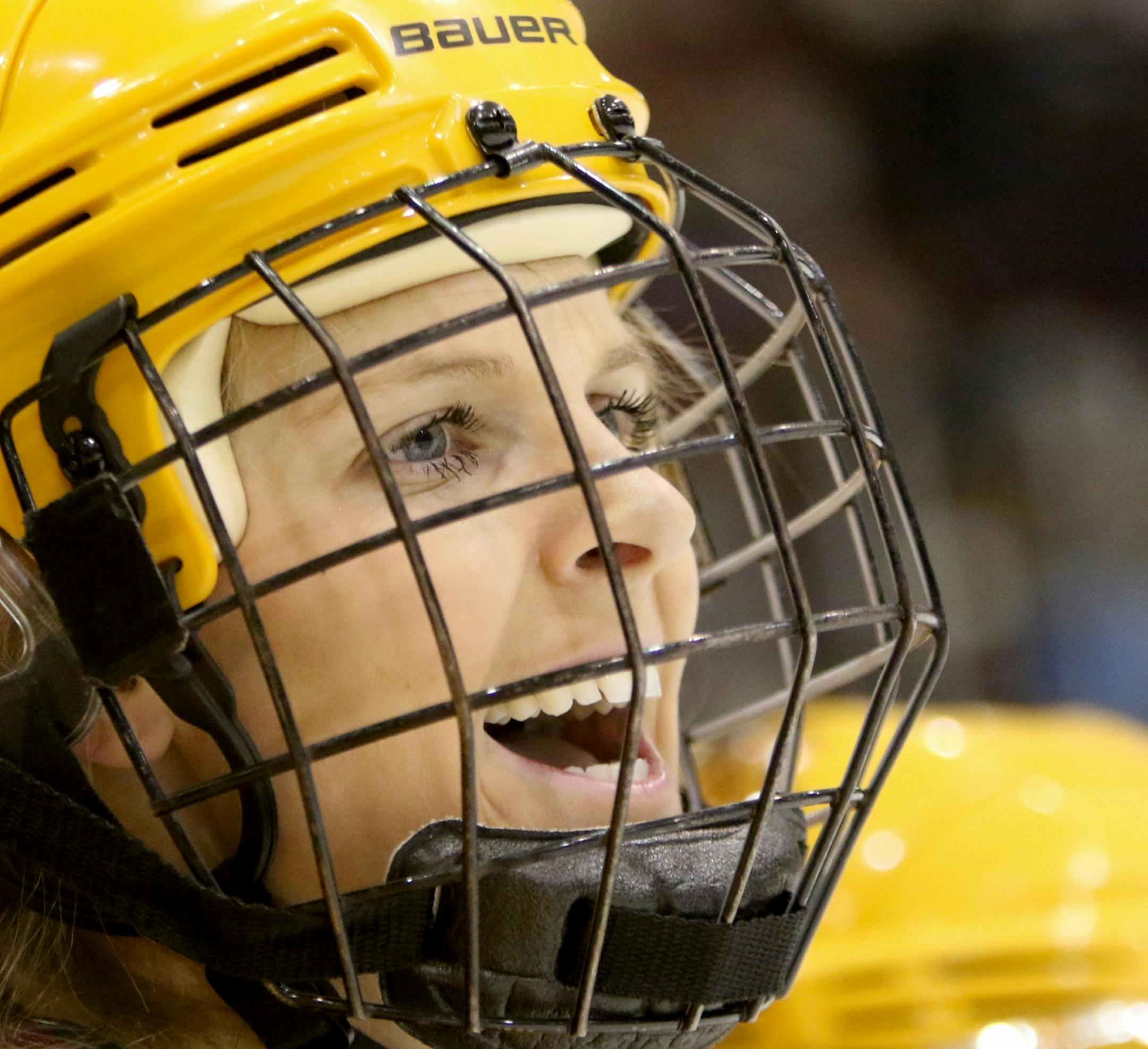 Amanda Kessel cheers on her teammates from the bench during first period action action against North Dakota Friday, Feb. 5, 2016, at Ridder Arena on the campus of the University of Minnesota in Minneapolis, MN.