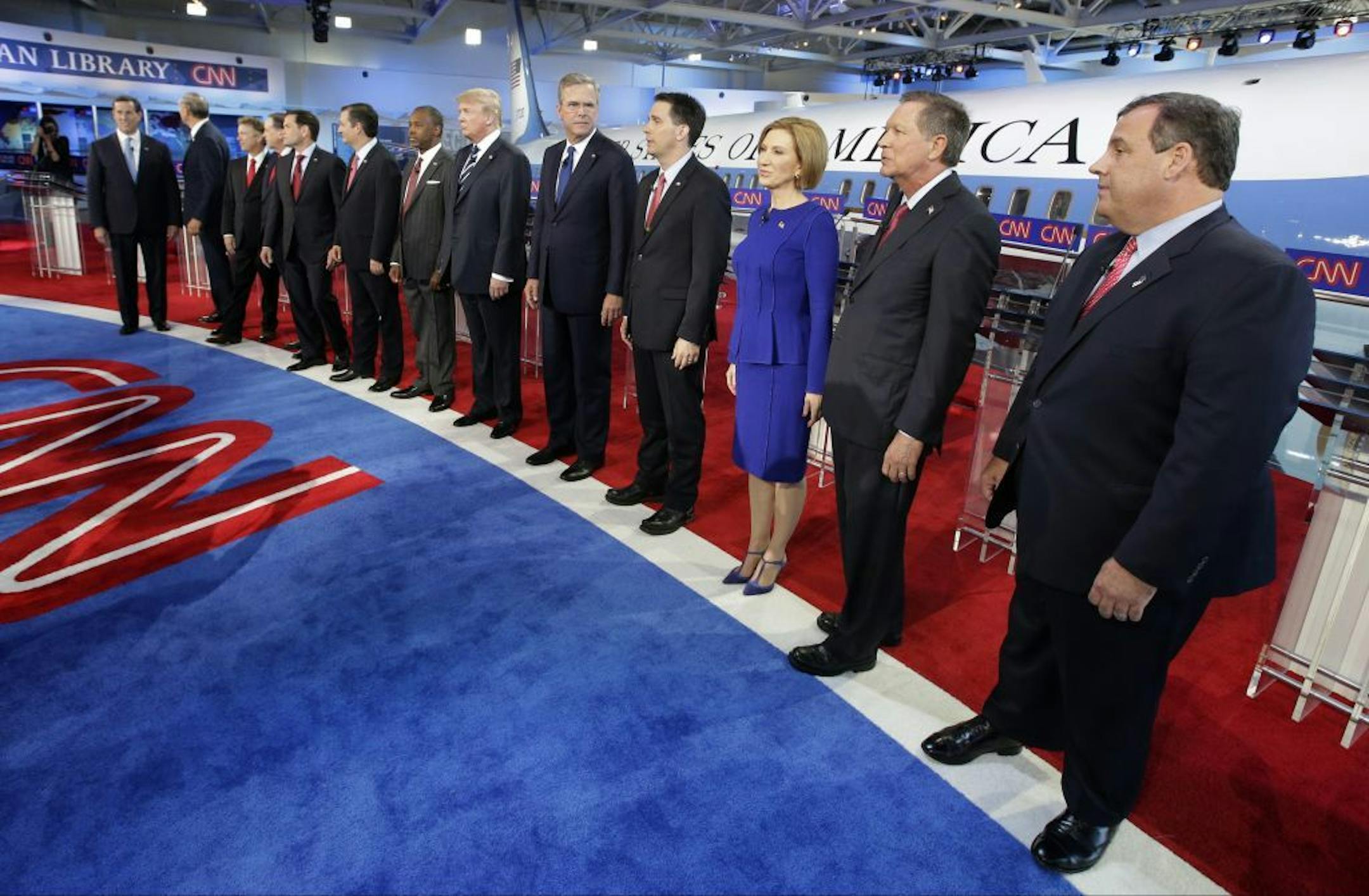 Republican presidential candidates, from left, former Pennsylvania Sen. Rick Santorum, former New York Gov. George Pataki, Sen. Rand Paul, R-Ky., former Arkansas Gov. Mike Huckabee, Sen. Marco Rubio, R-Fla., Sen. Ted Cruz, R-Texas, retired neurosurgeon Ben Carson, businessman Donald Trump, former Florida Gov. Jeb Bush, Wisconsin Gov. Scott Walker, businesswoman Carly Fiorina, Ohio Gov. John Kasich, and New Jersey Gov. Chris Christie take the stage during the CNN Republican presidential debate at
