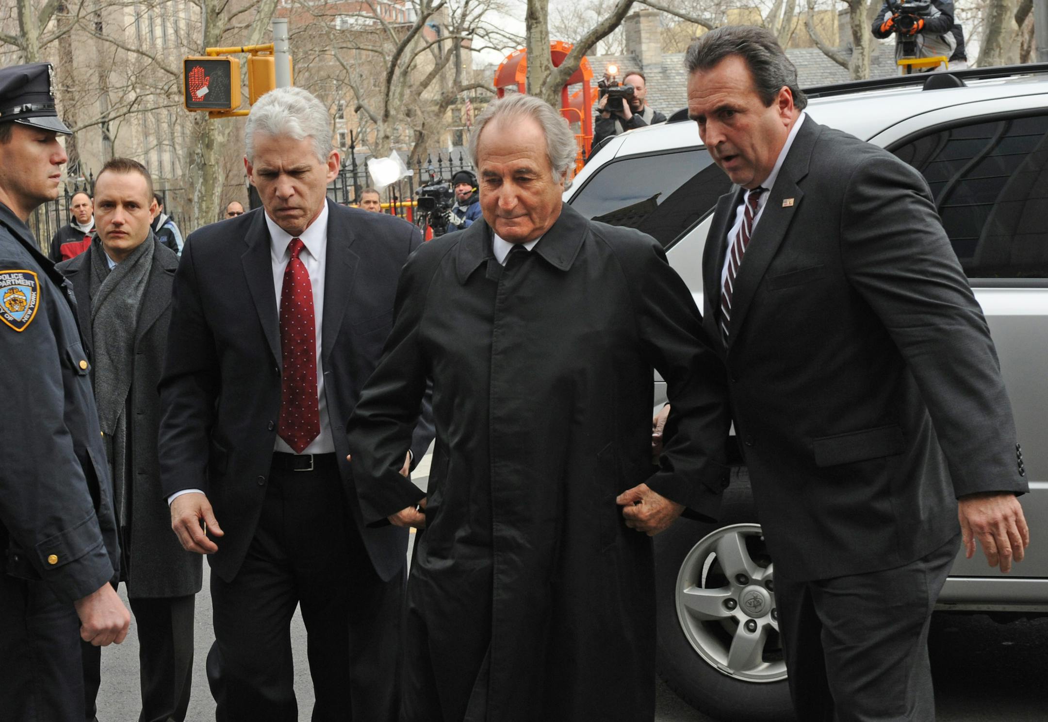 Bernard Madoff arrives at Manhattan federal court for a hearing to discuss potential conflicts of interest between him and his lawyer, Tuesday, March 10, 2009, in New York. (AP Photo/ Louis Lanzano)