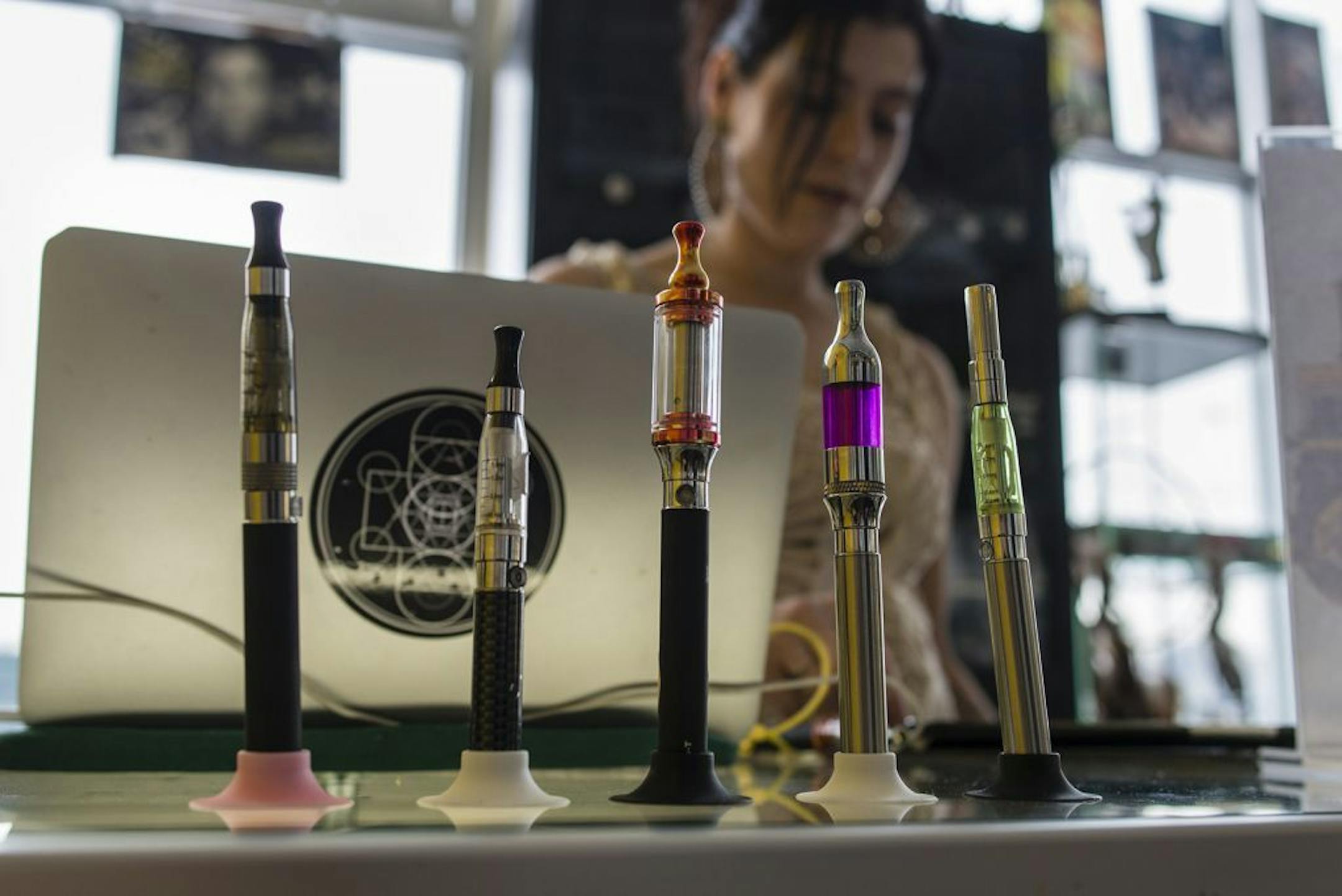 Vaporizers sit on display at the Brooklyn Vaper shop in the Brooklyn borough of New York, U.S., on Saturday, Feb. 8, 2014.