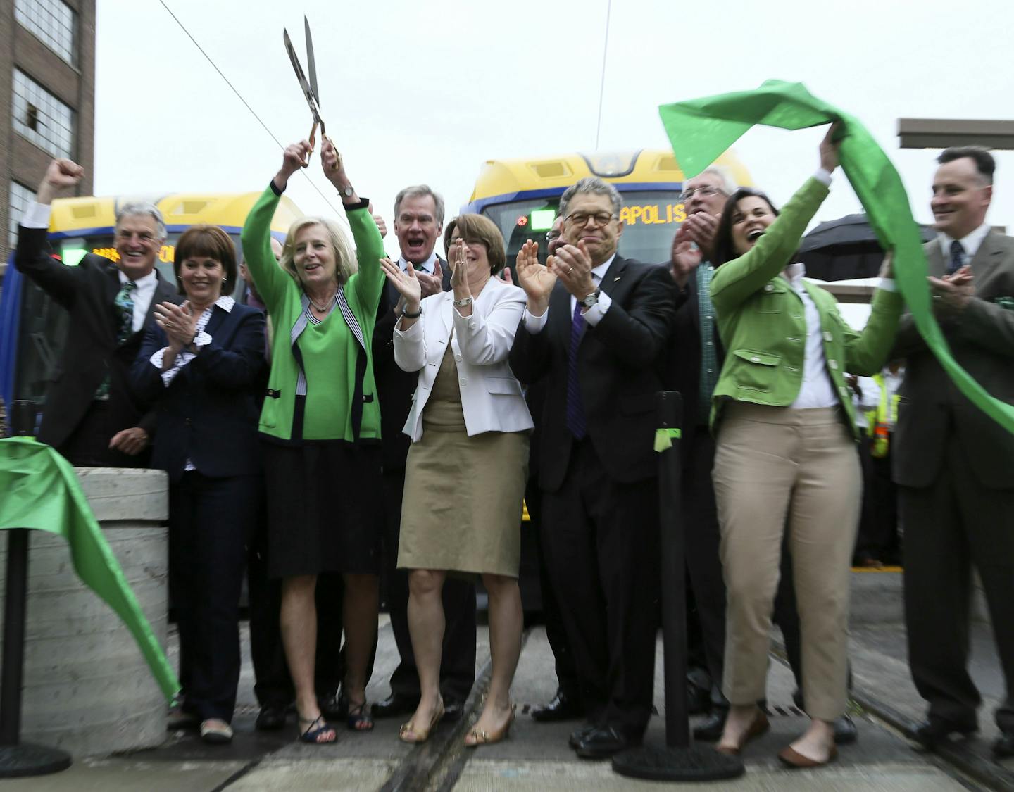 Dignitaries celebrate the official opening of the Greenline following a ribbon cutting Saturday, June 14, 2014, at Union Station in St. Paul, MN.] (DAVIDJOLES/STARTRIBUNE) djoles@startribune.com After more than a decade of planning and nearly a billion dollars of public money, the Twin Cities' second light-rail line begins running Saturday as officials cut ribbons for the Green Line.