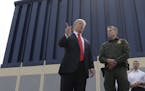 President Donald Trump reviews border wall prototypes, Tuesday, March 13, 2018, in San Diego. (AP Photo/Evan Vucci)