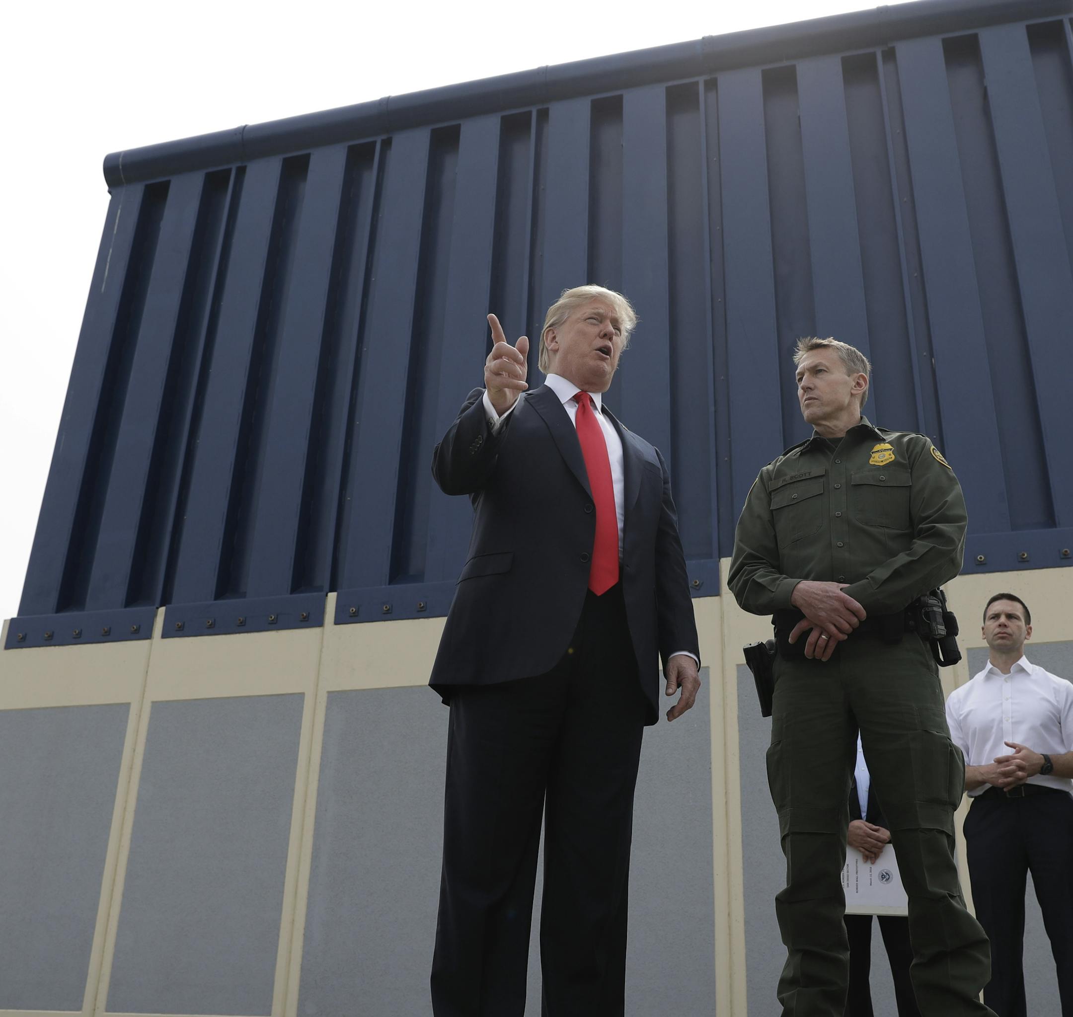 President Donald Trump reviews border wall prototypes, Tuesday, March 13, 2018, in San Diego. (AP Photo/Evan Vucci)