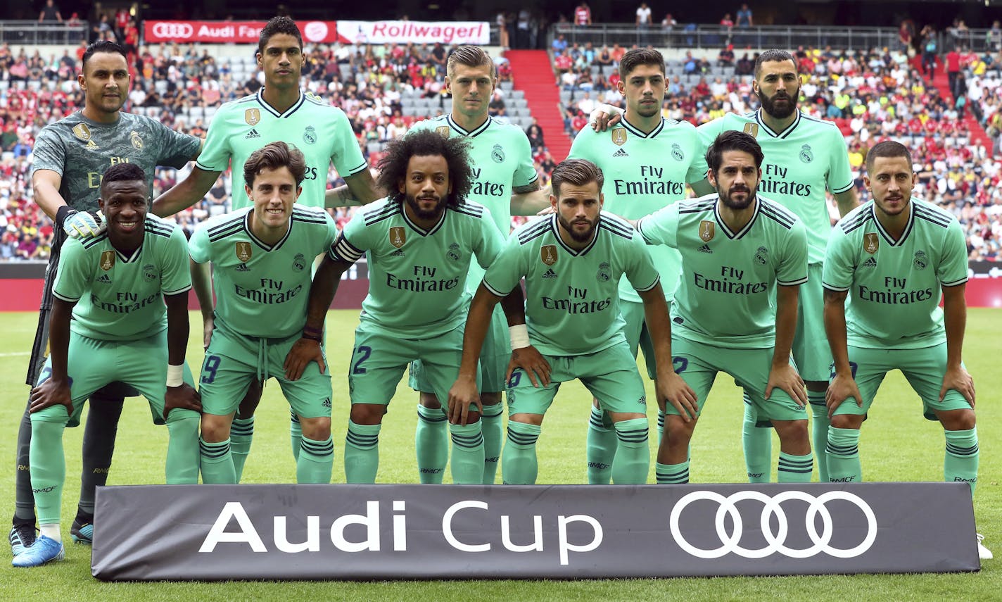 Real Madrid's players line up for a team photo prior to the friendly soccer Audi Cup match between Real Madrid and Fenerbahce Istanbul at the Allianz Arena stadium in Munich, Germany, Wednesday, July 31, 2019. (AP Photo/Matthias Schrader)