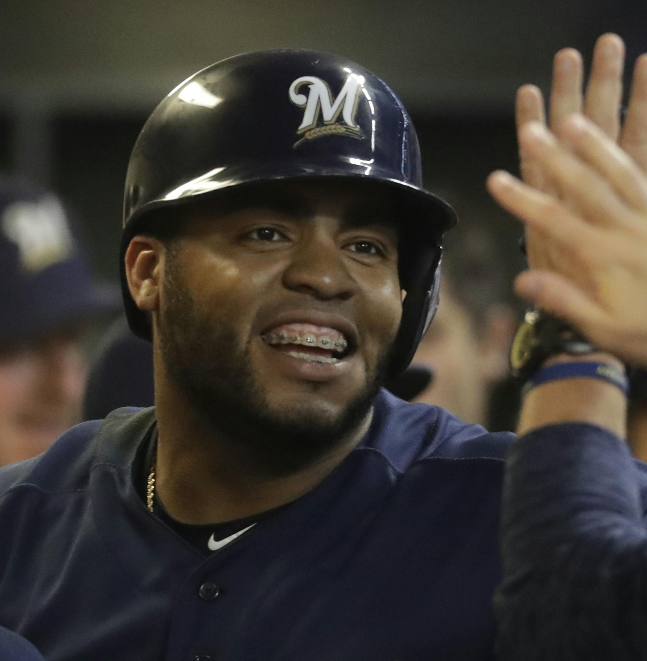 Milwaukee Brewers' Jesus Aguilar celebrates after hitting a home run during the third inning of a baseball game against the Kansas City Royals Tuesday, June 26, 2018, in Milwaukee. (AP Photo/Morry Gash)