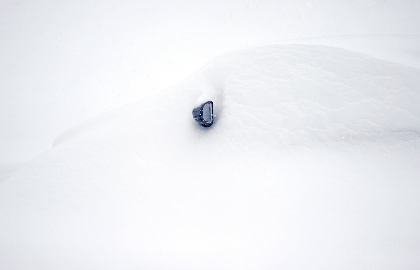 Yes, there is a car under there! This was in the parking lot at Burnsville Center, as Wednesday's snow piled up after heavy bands moved through in the morning.