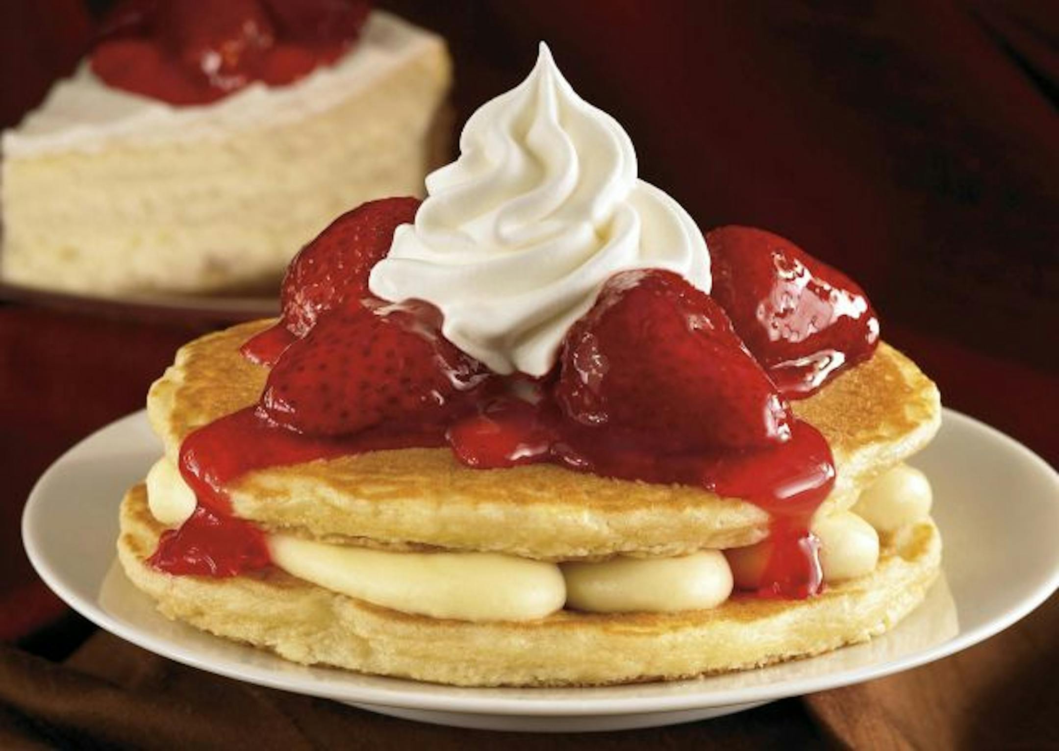 This undated photo provided by IHOP Restaurants shows their Pancake Stackers. IHOP's Pancake Stackers consists of cheesecake filling surrounded by two buttermilk pancakes and topped with a strawberry, blueberry or cinnamon apple compote and whipped topping. (AP Photo/IHOP Restaurants) NO SALES