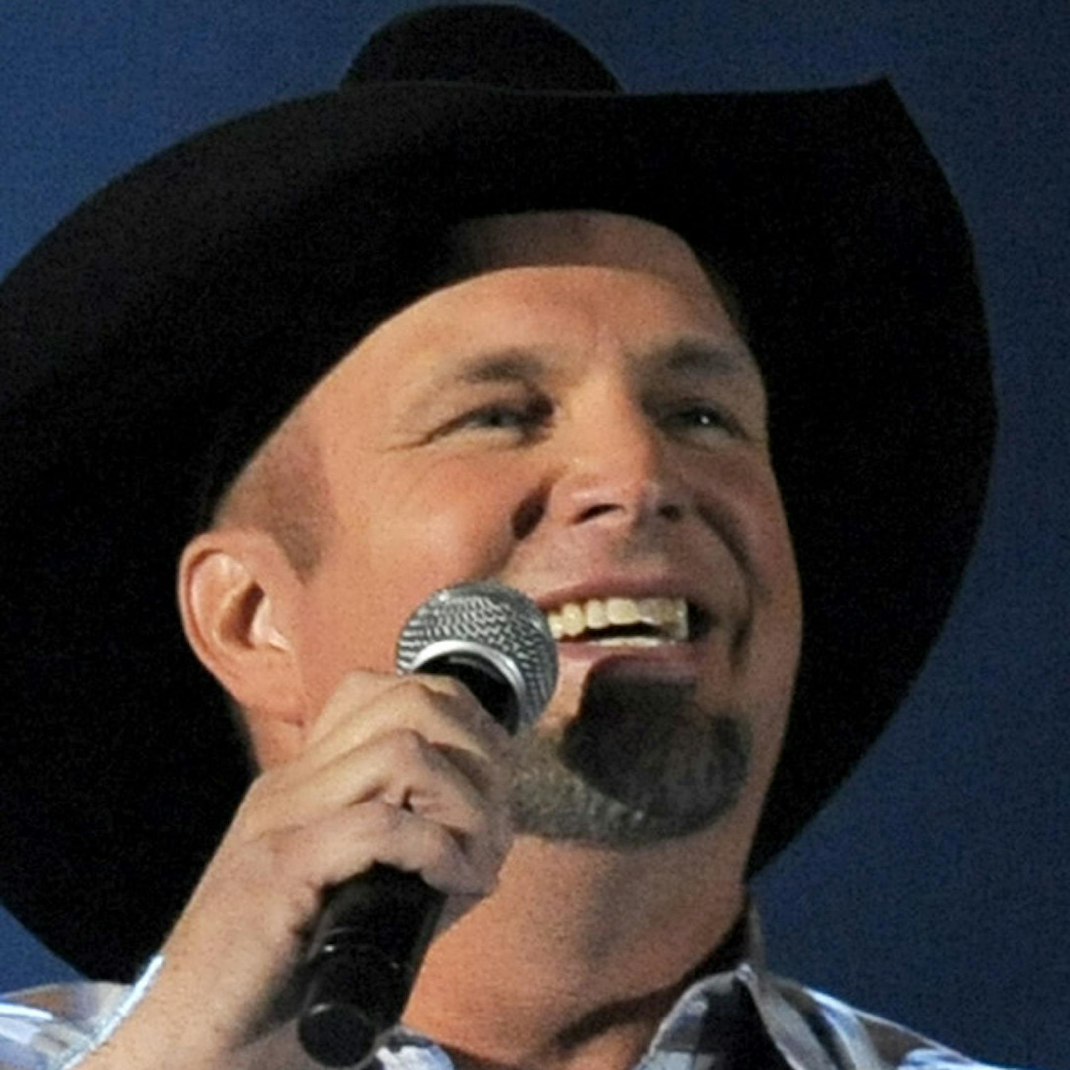 FILE - This April 7, 2013 file photo shows Garth Brooks performing at the 48th Annual Academy of Country Music Awards in Las Vegas, Nev. Brooks will perform a rare live broadcast concert special from the Encore Theater at the Wynn Las Vegas on Friday, Nov. 29. (Photo by Chris Pizzello/Invision/AP, File)