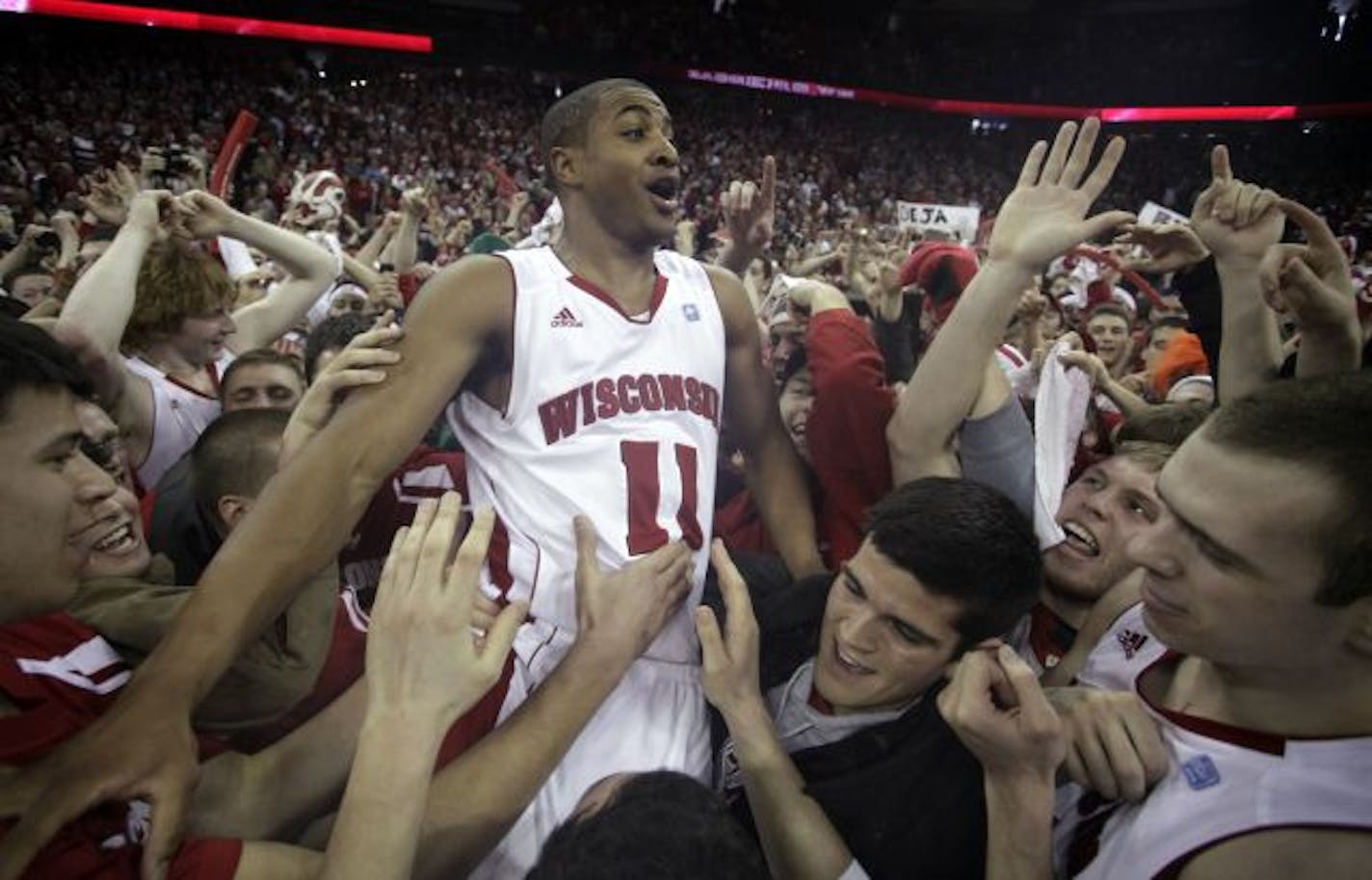 In happier times, Jordan Taylor celebrated with fans after beating then-undefeated No. 1 Ohio State 71-67 in February.