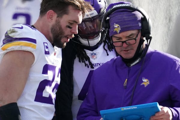 Vikings safety Harrison Smith, left, with coach Mike Zimmer.