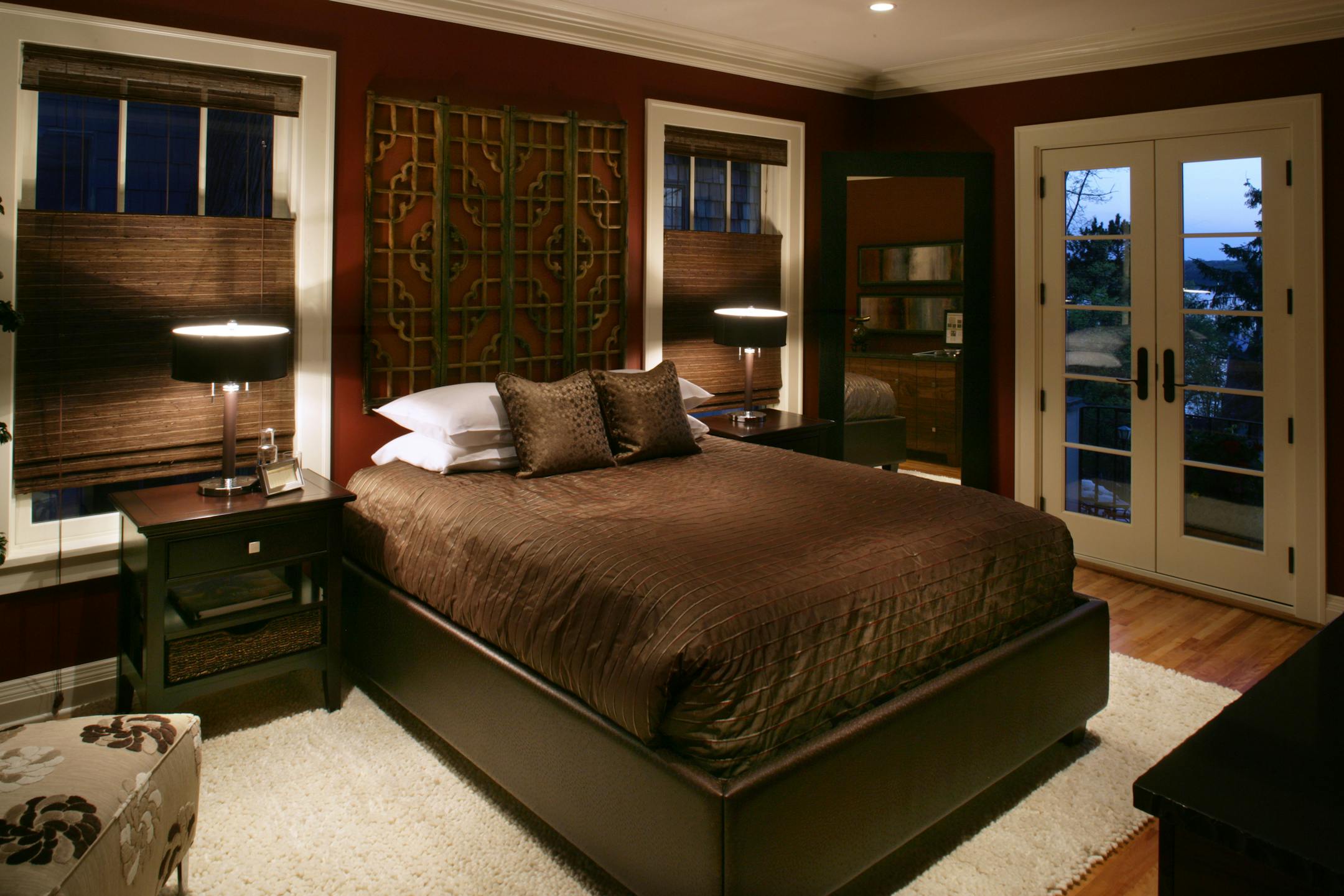 Guest suite: The starting point for the modern, Zen-like guest retreat was a headboard made from antique Asian screens, said designer Suzanne Goodwin, who collaborated with Laura Paulson. Design tip: To make the space both sophisticated and cozy, the designers used deep russet hues and unexpected textures, such as the platform bed upholstered in a synthetic that resembles ostrich skin.