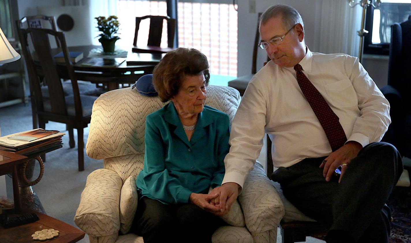 Hennepin County Attorney Mike Freeman and his mother, Jane. Each vividly remembers the moment each learned that President Kennedy had been shot.