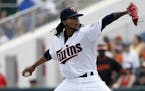 Minnesota Twins' Ervin Santana works against the Baltimore Orioles in the first inning of a spring training baseball game in Fort Myers, Fla., Sunday,