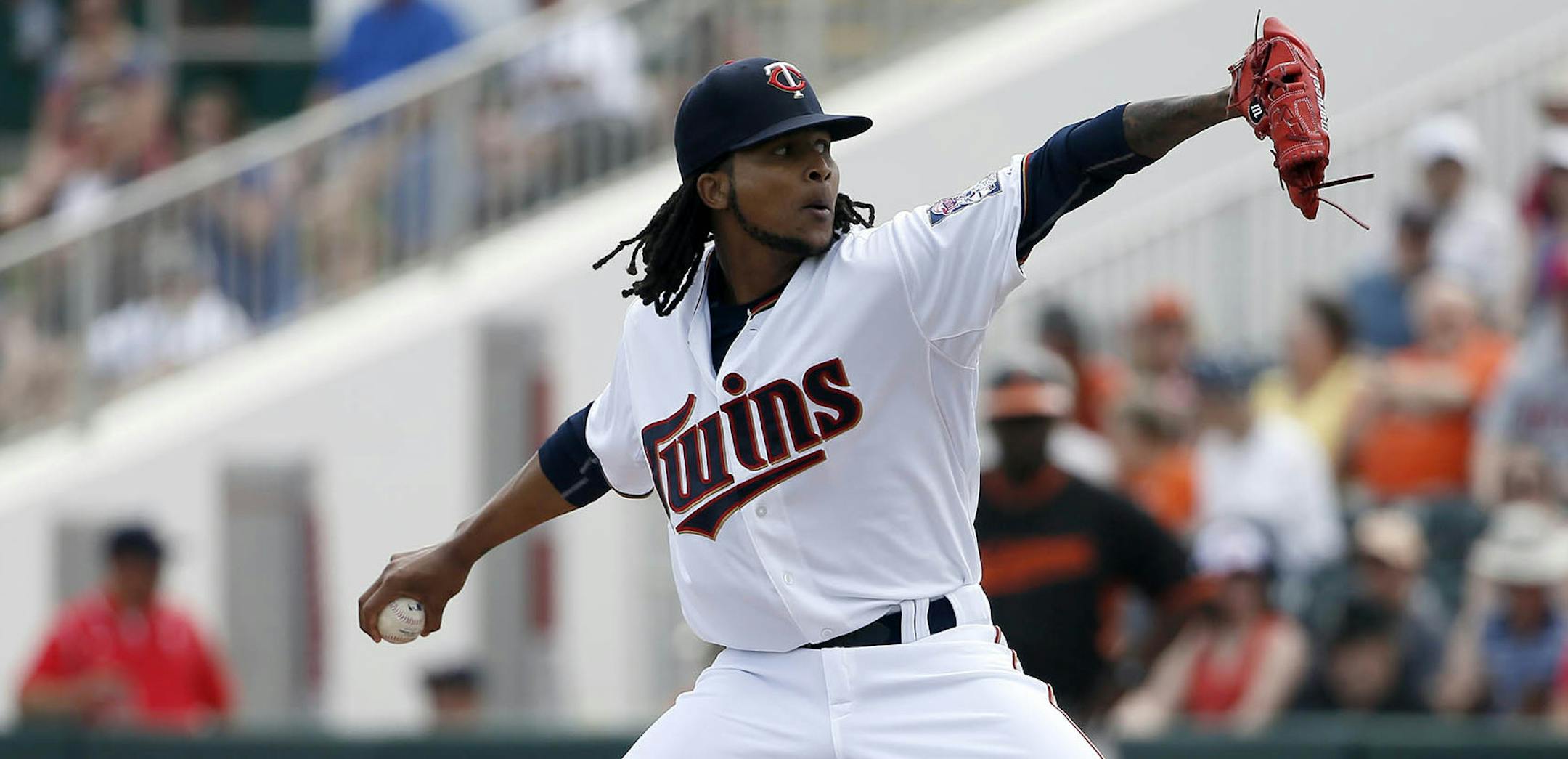 Minnesota Twins' Ervin Santana works against the Baltimore Orioles in the first inning of a spring training baseball game in Fort Myers, Fla., Sunday, March 8, 2015. (AP Photo/Tony Gutierrez) ORG XMIT: MIN2015040318254981