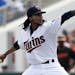 Minnesota Twins' Ervin Santana works against the Baltimore Orioles in the first inning of a spring training baseball game in Fort Myers, Fla., Sunday,