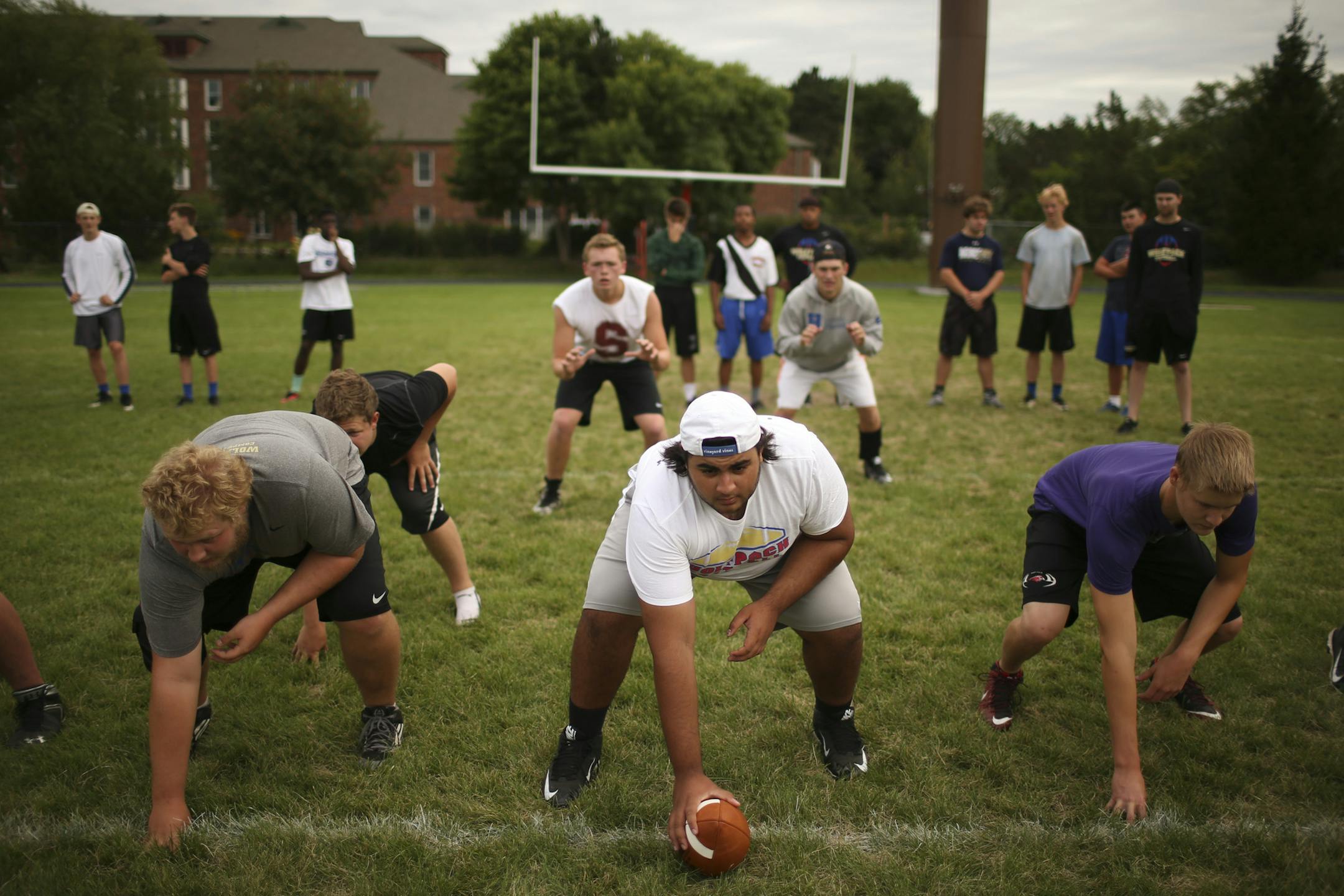 The offensive line of Kyle Salverda of SPA, Armaan Gori of Blake, and Alistair Davis of Minnehaha Academy, from left, with fullback Grant Steinkopf of Minnehaha Academy, quarterback Samuel Pickerign of Minnehaha Academy and running back Michael O'Shea of SPA at practice Monday afternoon at Minnehaha Academy. ] JEFF WHEELER &#x2022; jeff.wheeler@startribune.com Three schools have formed a new football cooperative. The SPA-Minnehaha Academy-Blake (SMB) Wolfpack is the first football coop that can