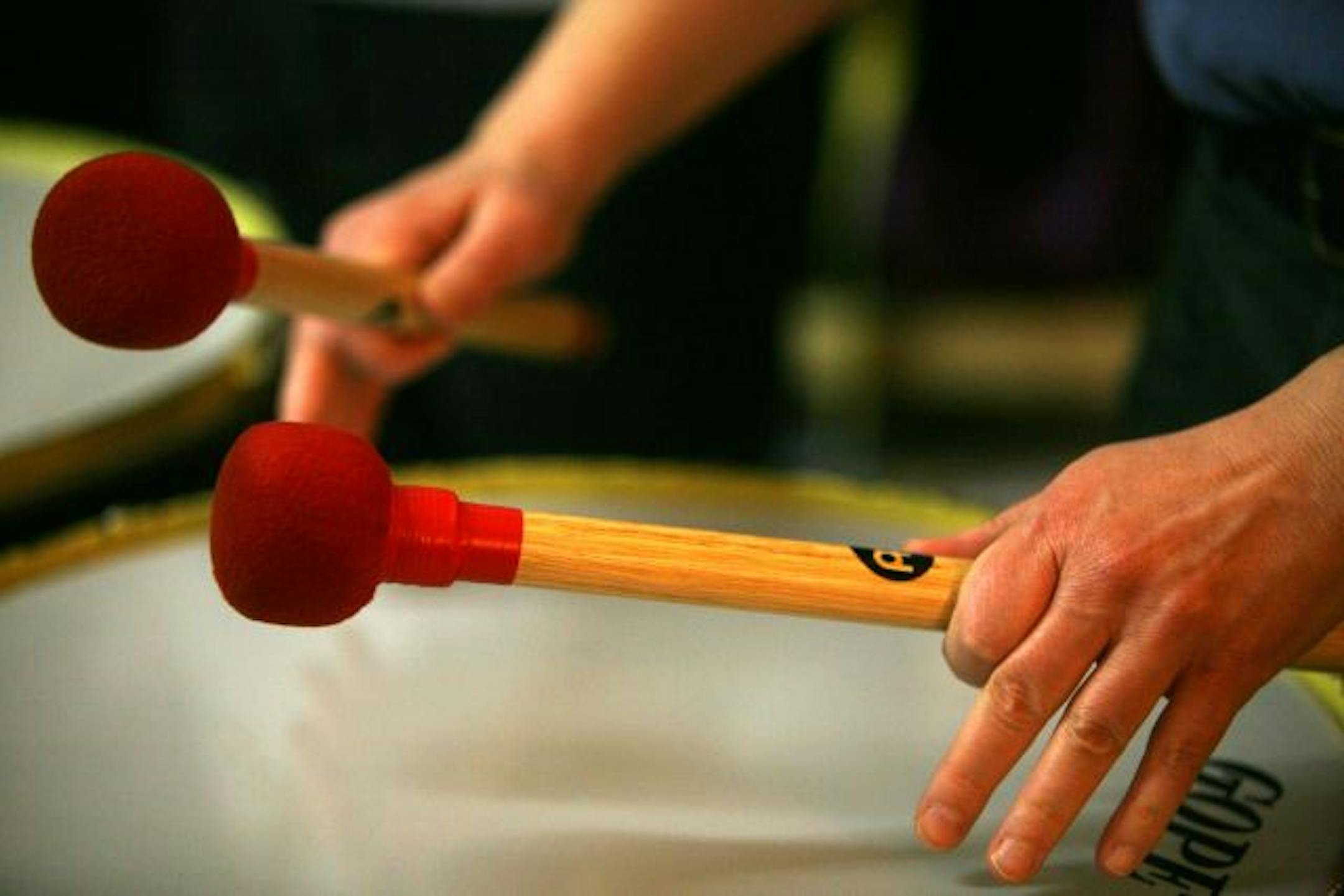 Jill Beyer, a member of Women's Drum Center waited for her moment to play as the group in performed a piece of music called the Merengue.