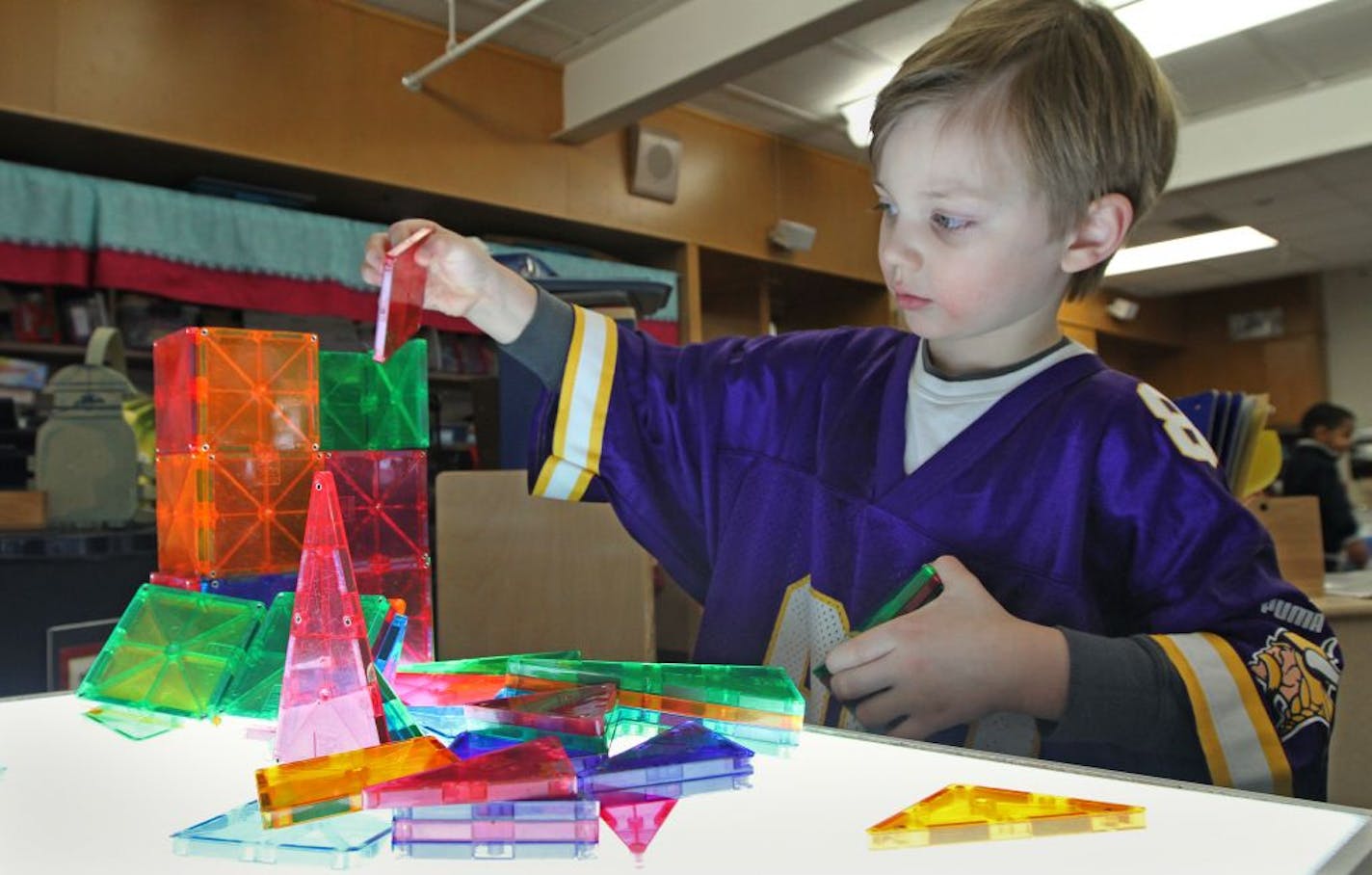 Noah Carr worked with plastic blocks on a light table in Lucy Lyons' preschool class at Glen Lake Elementary in Minnetonka. The Hopkins district's effort is the state's first known introduction of science, technology, engineering and math (STEM) to preschoolers.