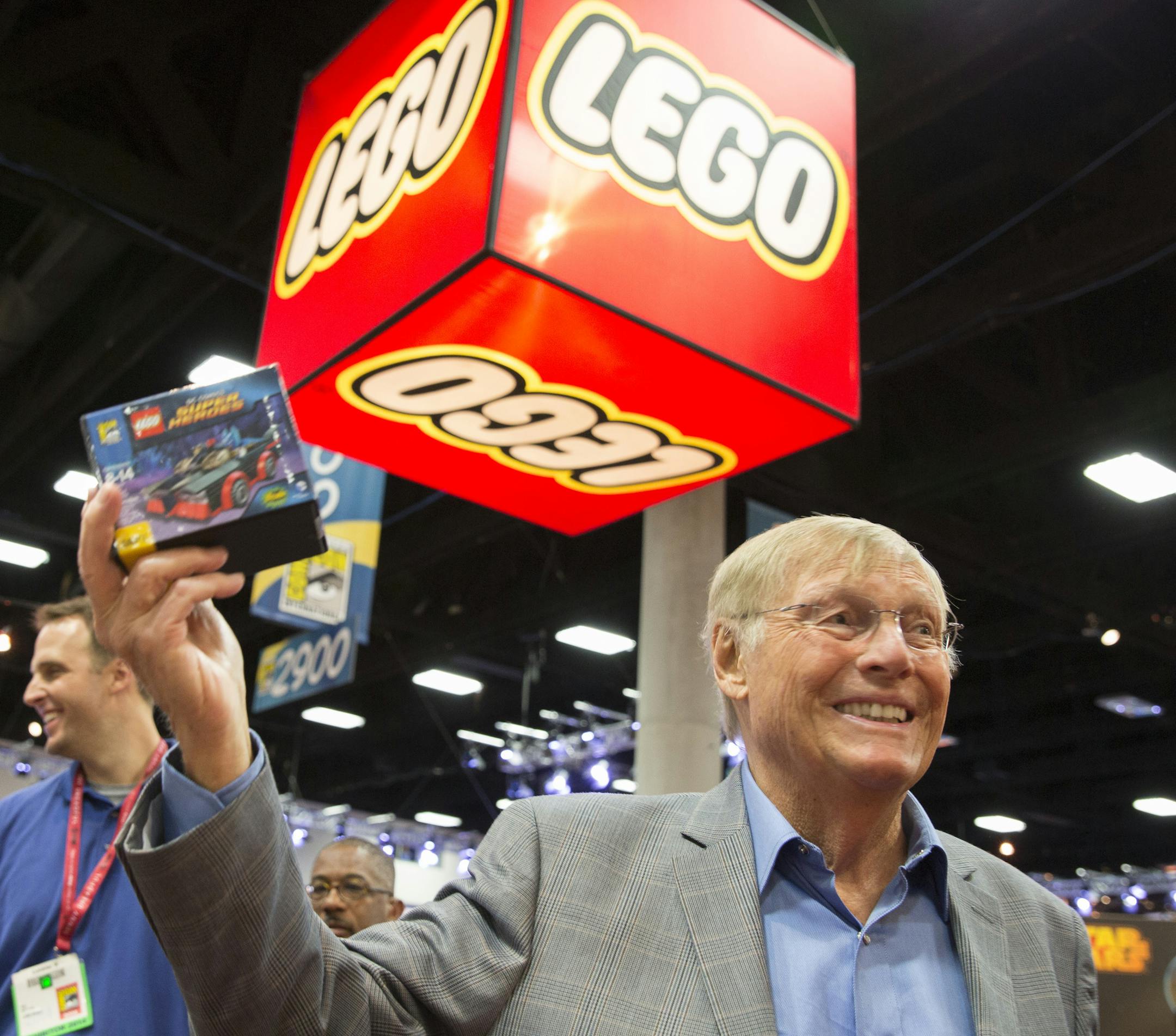 IMAGE DISTRIBUTED FOR THE LEGO GROUP - Adam West, who starred as Batman in the original TV series, holds an exclusive San Diego Comic Con Batmobile set at San Diego International Comic Con in San Diego, Calif. on Friday, July 25, 2014. (Fred Greaves/AP Images for The LEGO Group)