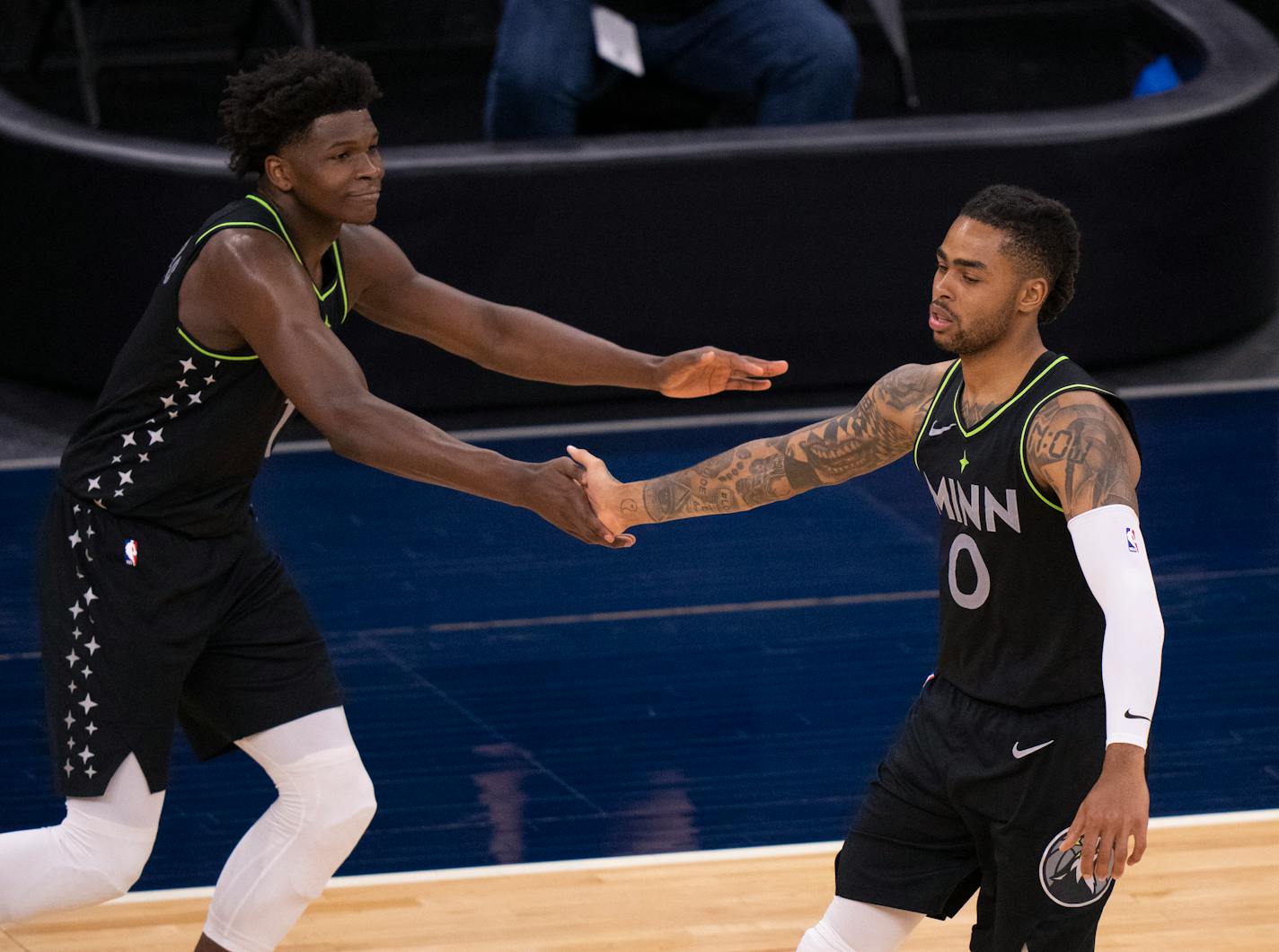 Minnesota Timberwolves forward Anthony Edwards (1) congratulated guard D'Angelo Russell (0) on hitting a three pointer in the third quarter. ] JEFF WHEELER • jeff.wheeler@startribune.com