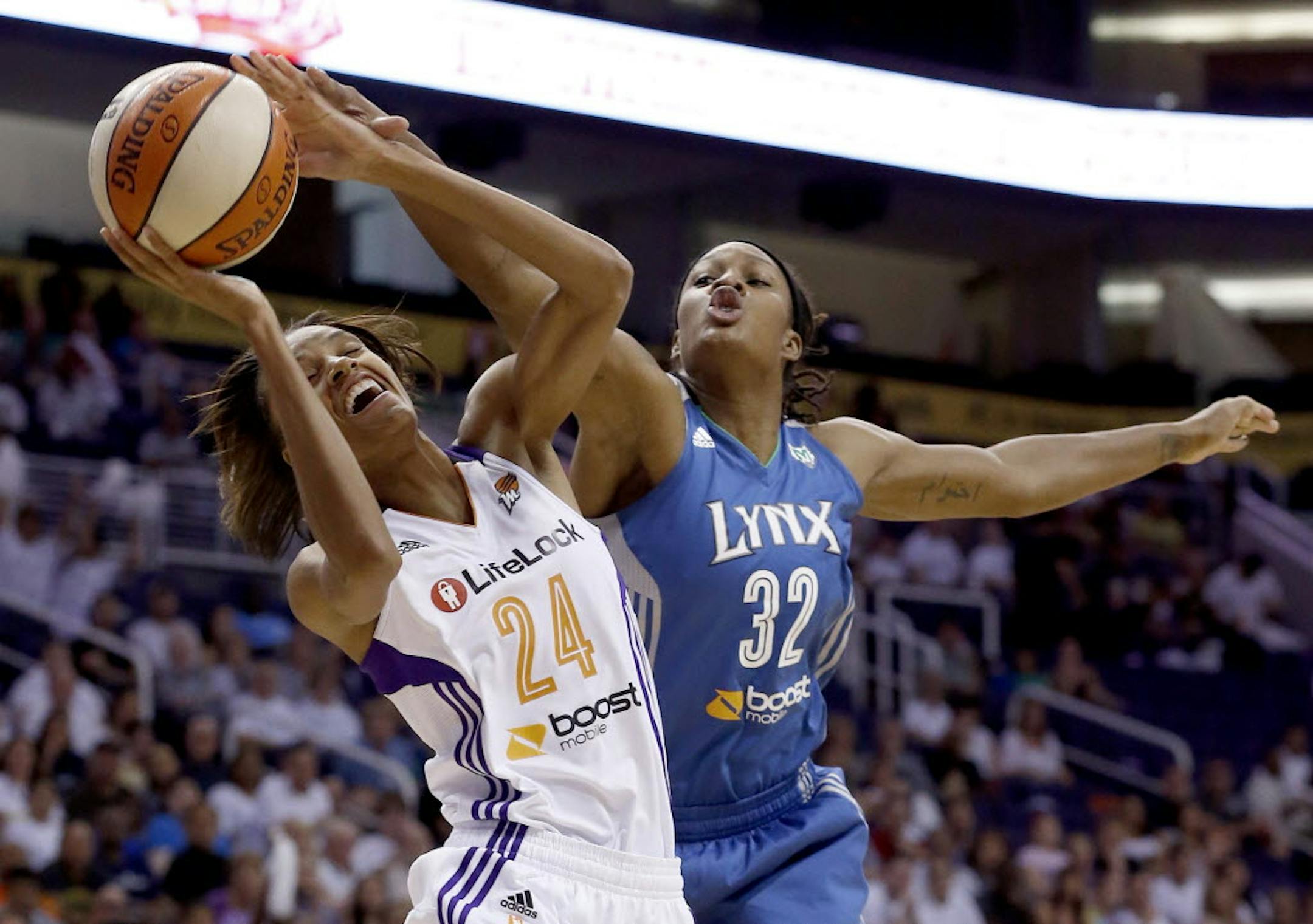 Minnesota's Rebekkah Brunson tries to block a shot by Phoenix Mercury's DeWanna Bonner during Sunday's Western Conference Finals game.