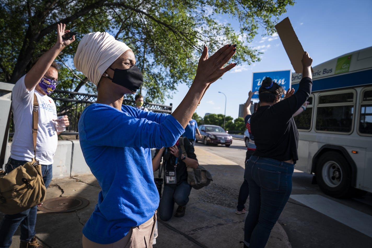 U.S. Rep. Ilhan Omar waved to cars and buses at the corner of Broadway Street and Central Avenue NE in Minneapolis. ] LEILA NAVIDI • leila.navidi@startribune.com BACKGROUND INFORMATION: U.S. Rep. Ilhan Omar participated in get out the vote and visibility events on Primary Election Day in Minneapolis on Tuesday, August 11, 2020.