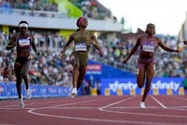 Sha'Carri Richardson celebrates her win in the wins women's 100-meter run final during the U.S. Track and Field Olympic Team Trials in Eugene, Ore., o