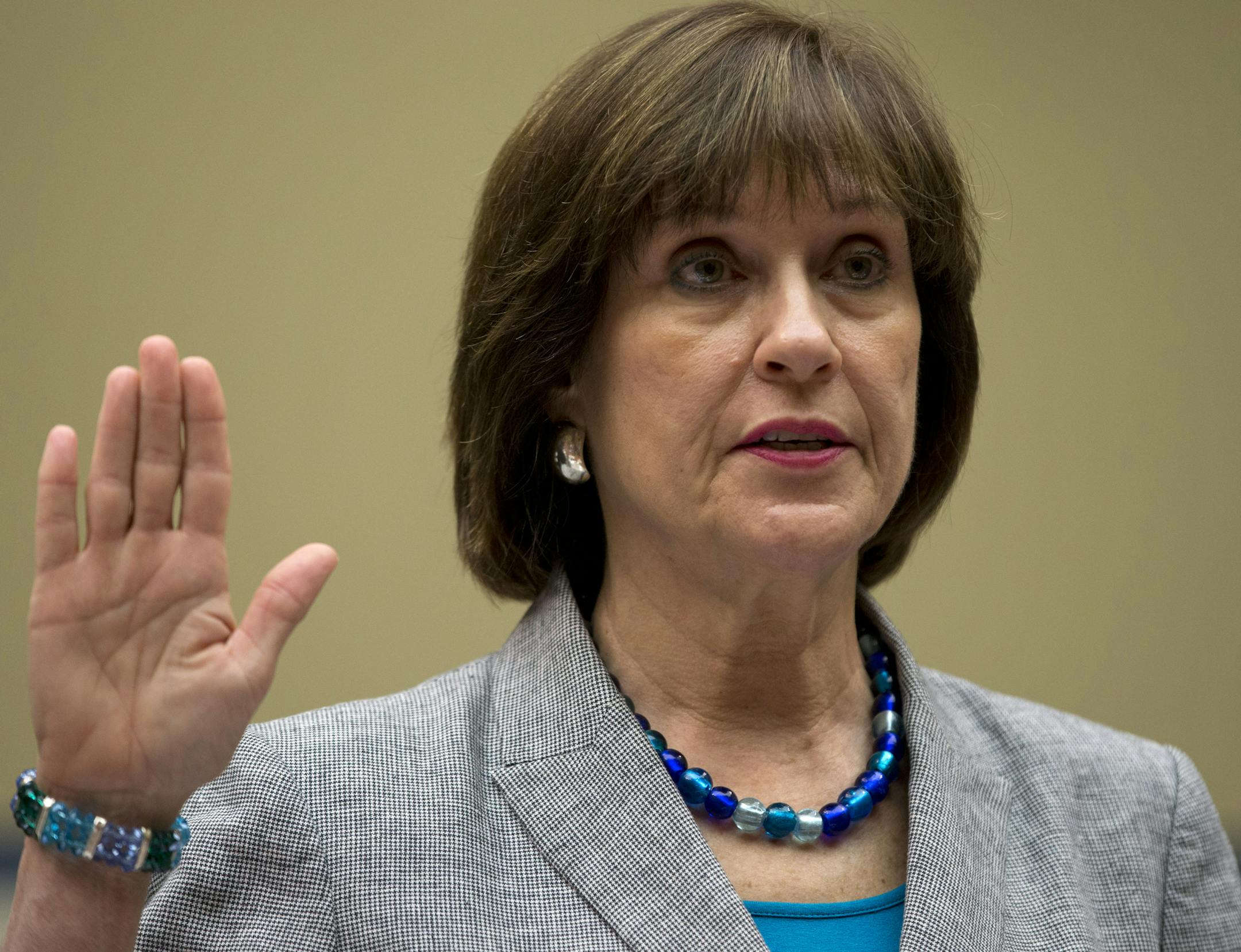 IRS official Lois Lerner is sworn in on Capitol Hill in Washington, Wednesday, May 22, 2013, before the House Oversight Committee hearing to investigate the extra scrutiny IRS gave to Tea Party and other conservative groups that applied for tax-exempt status. Lerner told the committee she did nothing wrong and then invoked her constitutional right to not answer lawmakers' questions. (AP Photo/Carolyn Kaster)