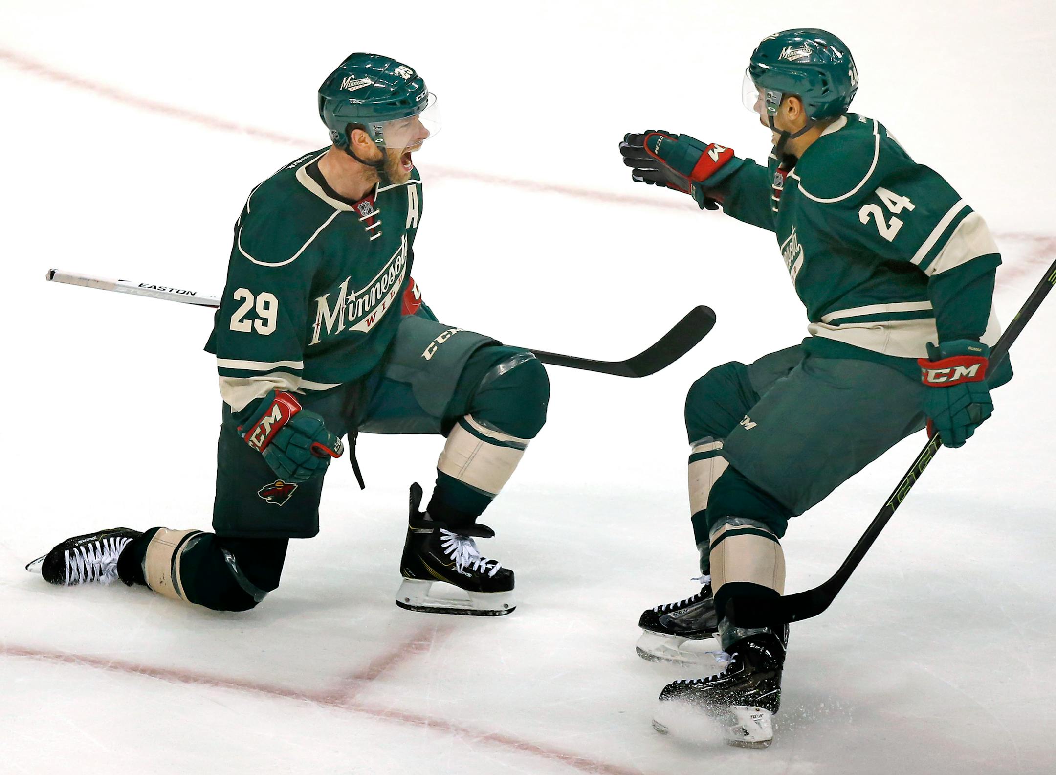 Jason Pominville (29) celebrated with Matt Dumba (24) after scoring goal in the second period.