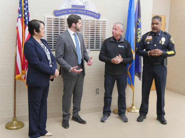 Dan Wolgamott (DFL - St. Cloud) and Tama Theis (R - St. Cloud), Mayor Dave Kleis, and Police Chief Blair Anderson spoke during a press conference abou