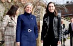 Swedish Prime Minister Magdalena Andersson, left, and Finnish Prime Minister Sanna Marin posed for photographers in Stockholm on April 13 ahead of a m