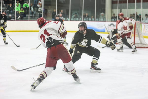Maple Grove’s Lucas Busch cranked a shot against Andover on Saturday, when the Crimson won 3-2, handing the Huskies their first loss since Jan. 5. B