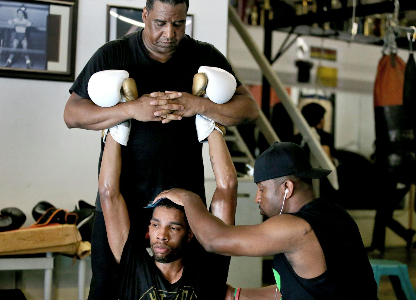 After 11 rounds in the ring, welterweight contender Jamal James got some TLC from the men he calls his second father and brother &#x2014; trainer Sankara Frazier, top, and his son, Adonis.