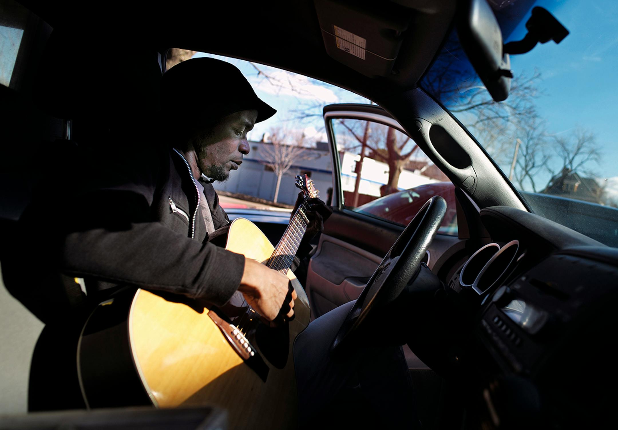 Jamie Carter, a guitar instructor/former student at Walker West Music Academy, practiced his guitar in his car. The institution in St. Paul's Summit University neighborhood that has been teaching folks how to make music for 26 years is moving to a building across the street behind Carter. ]richard.tsong-taatarii/rtsong-taatarii@startribune.com
