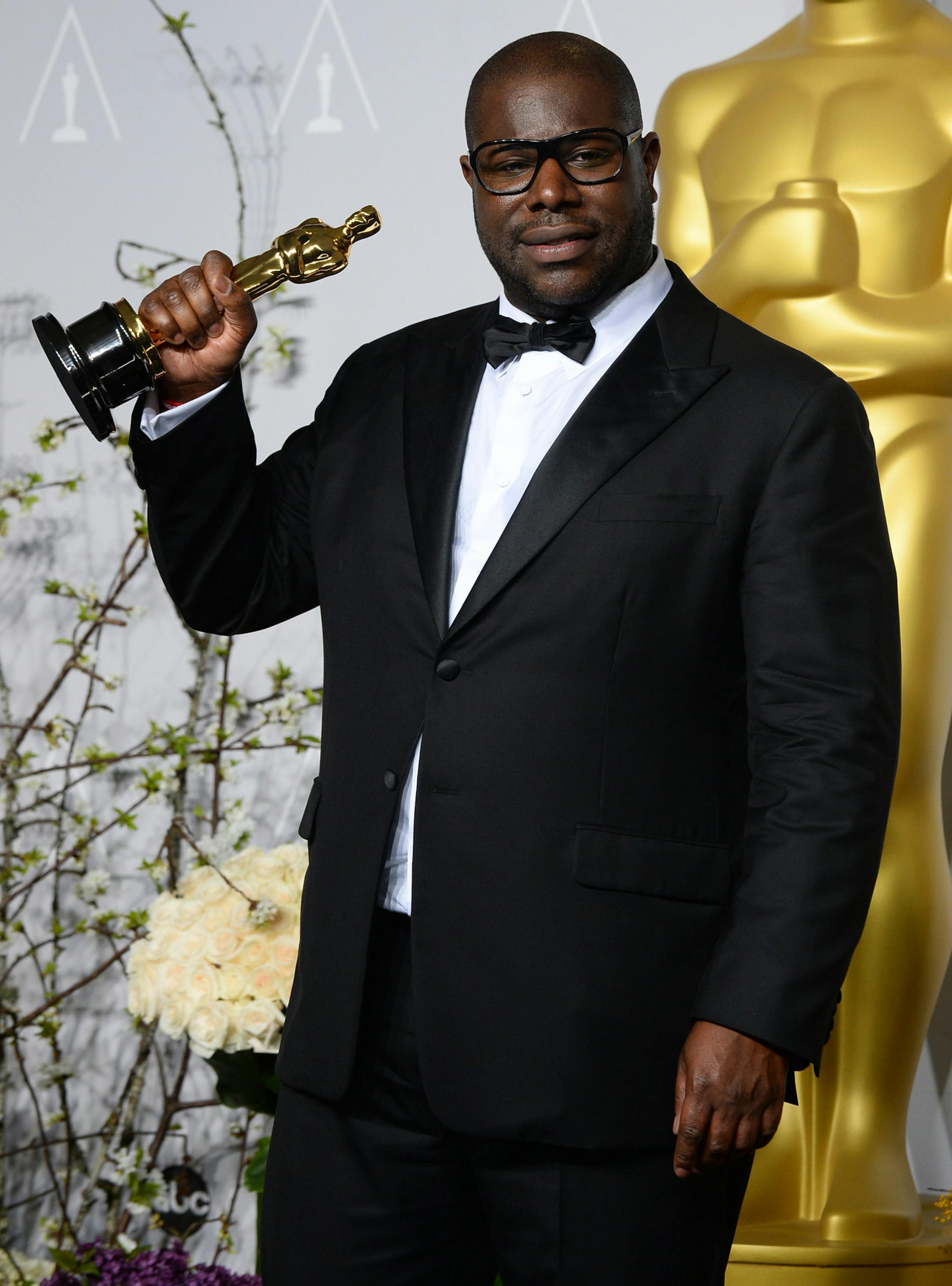 Director Steve McQueen poses in the press room with the award for best picture for "12 Years a Slave" during the Oscars at the Dolby Theatre on Sunday, March 2, 2014, in Los Angeles. (Photo by Jordan Strauss/Invision/AP)